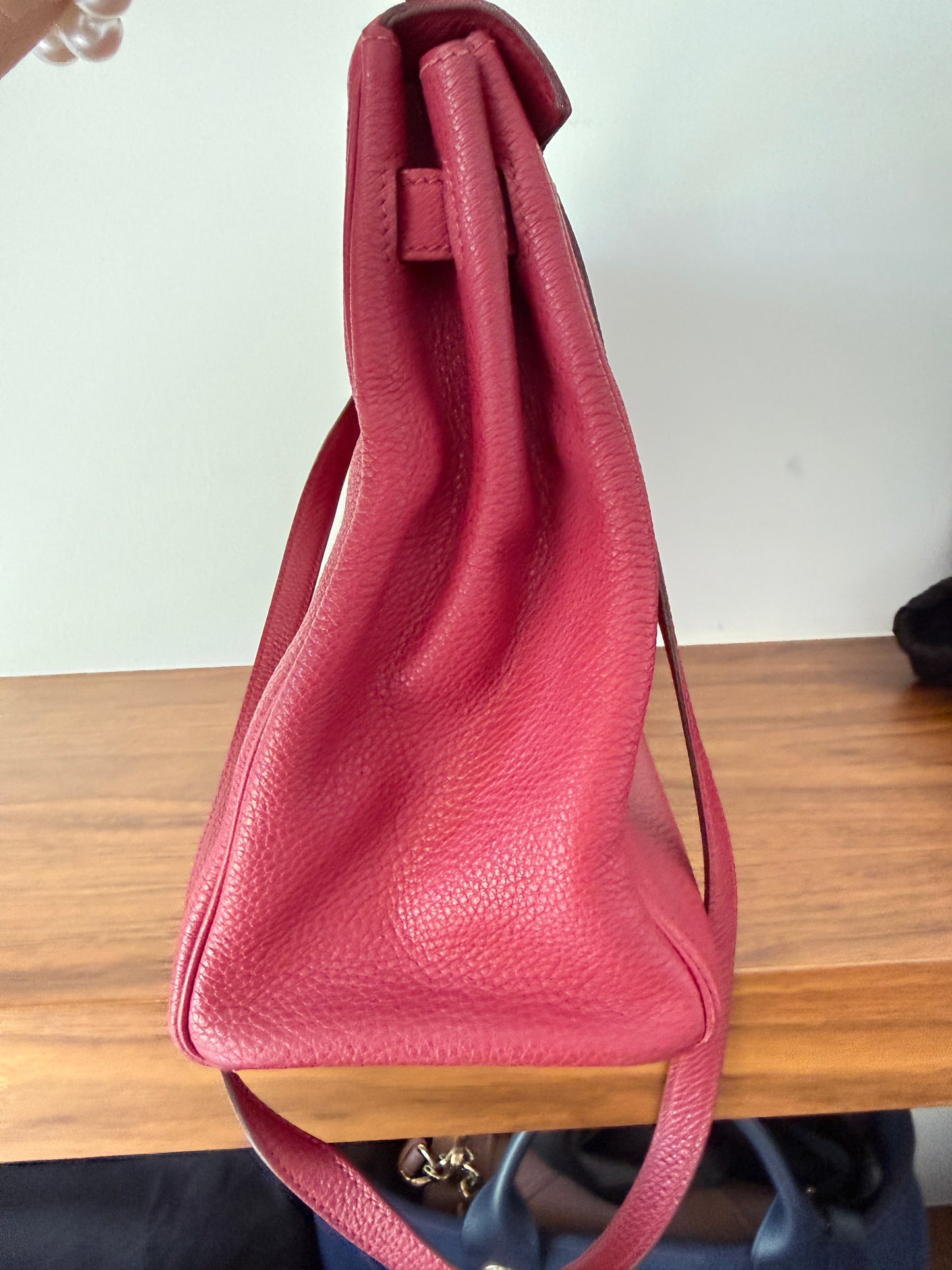 Hermes’ Kelly 35 Retourne Handbag in Togo Leather in Tosca Raspberry Pre-Owned