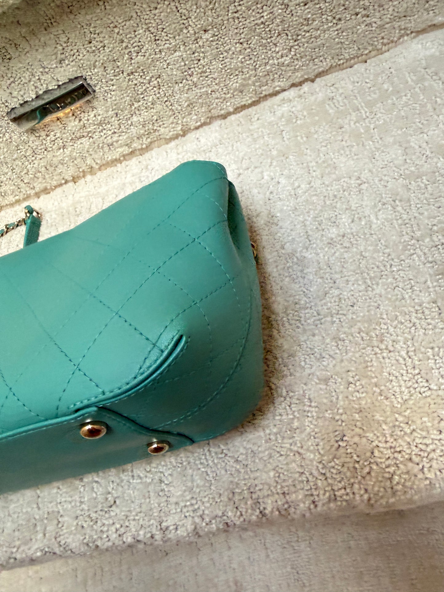 Chanel teal classic flap close up of fourth corner