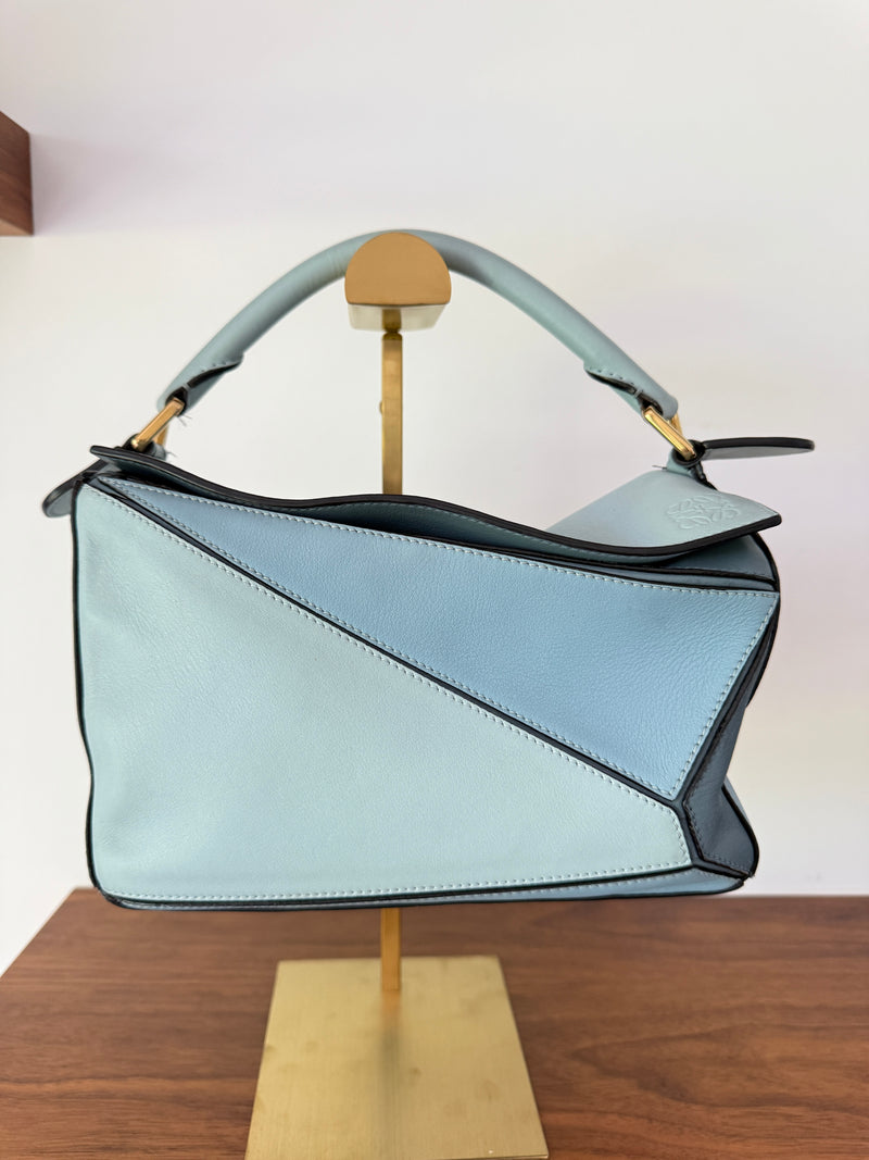 Loewe puzzle bag size small in multiple blue tones and is authentic and preowned
