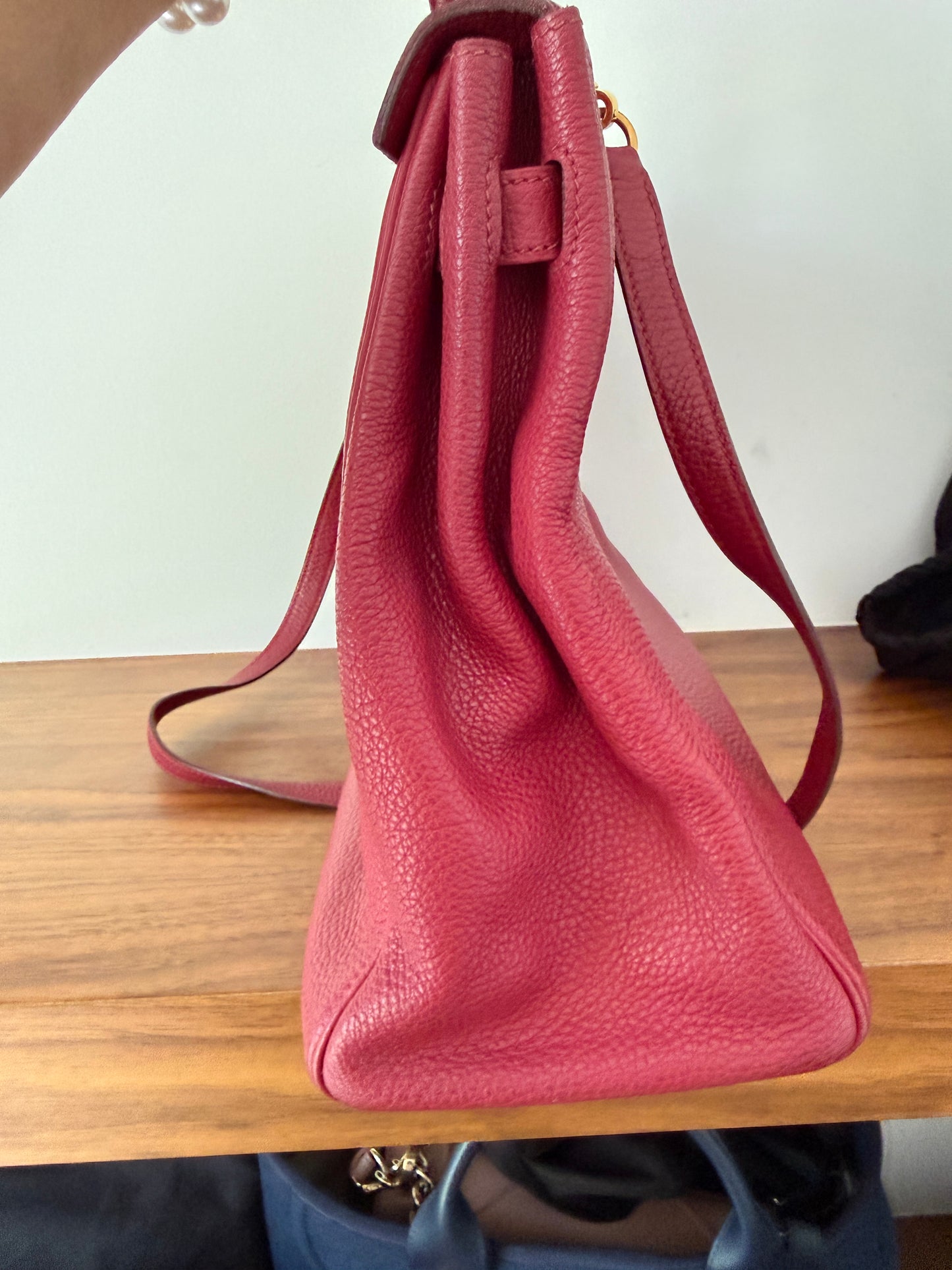 Hermes’ Kelly 35 Retourne Handbag in Togo Leather in Tosca Raspberry Pre-Owned