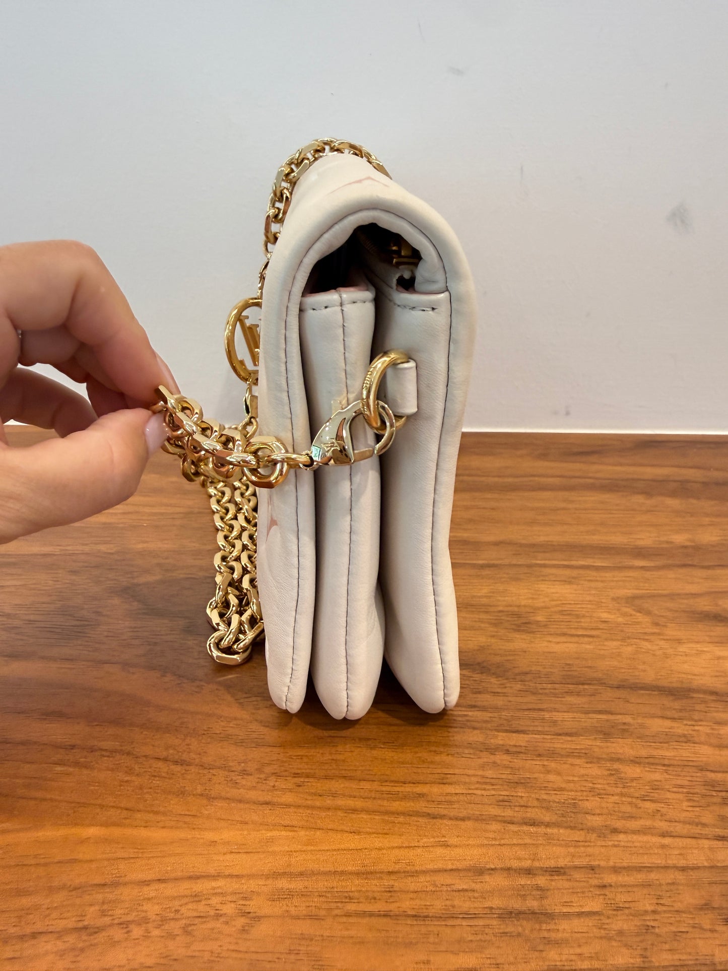 Louis Vuitton coussin pochette in cream showing other side of purse for sale