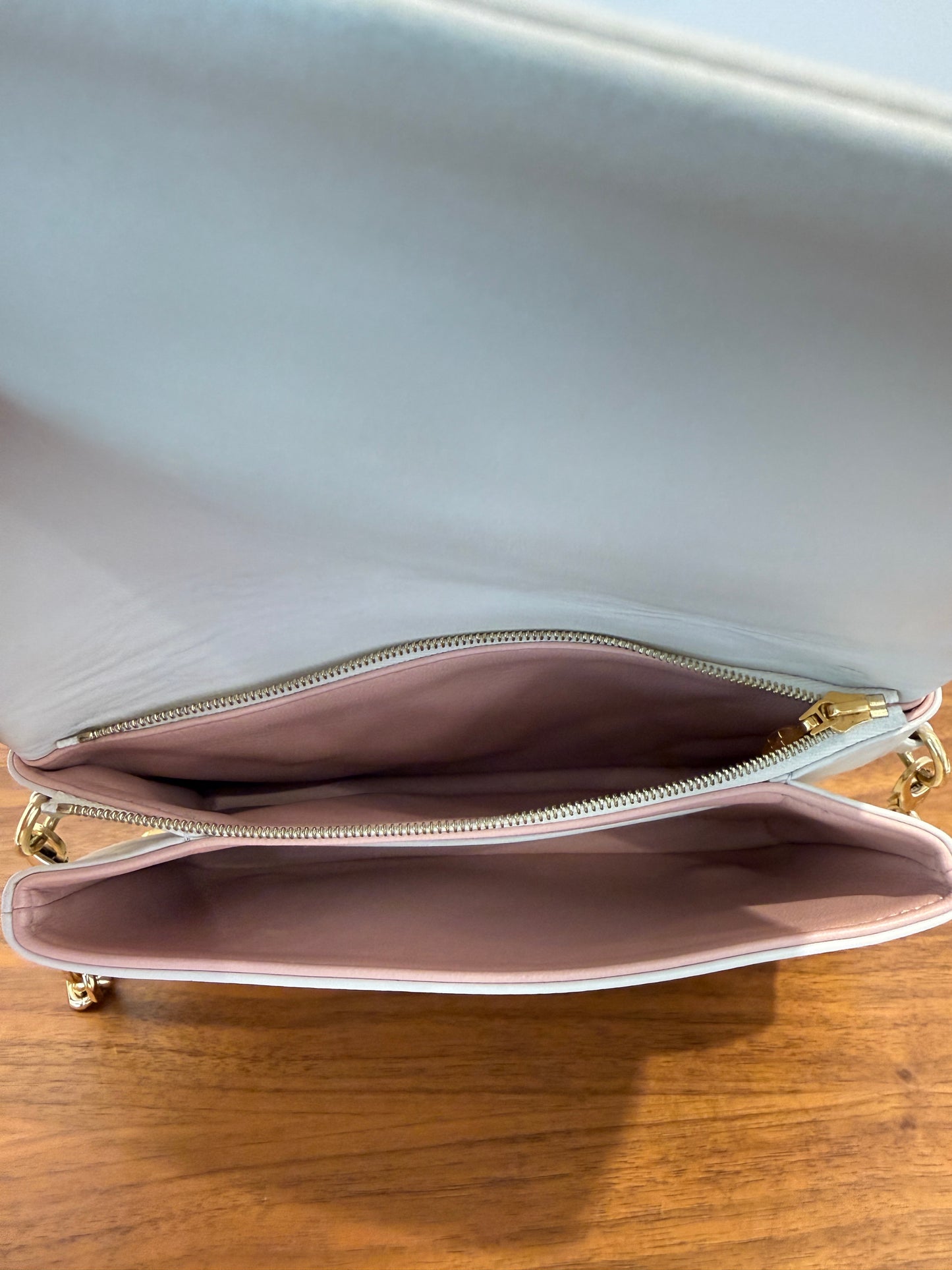 Louis Vuitton coussin pouchette view of pinkinterior of handbag