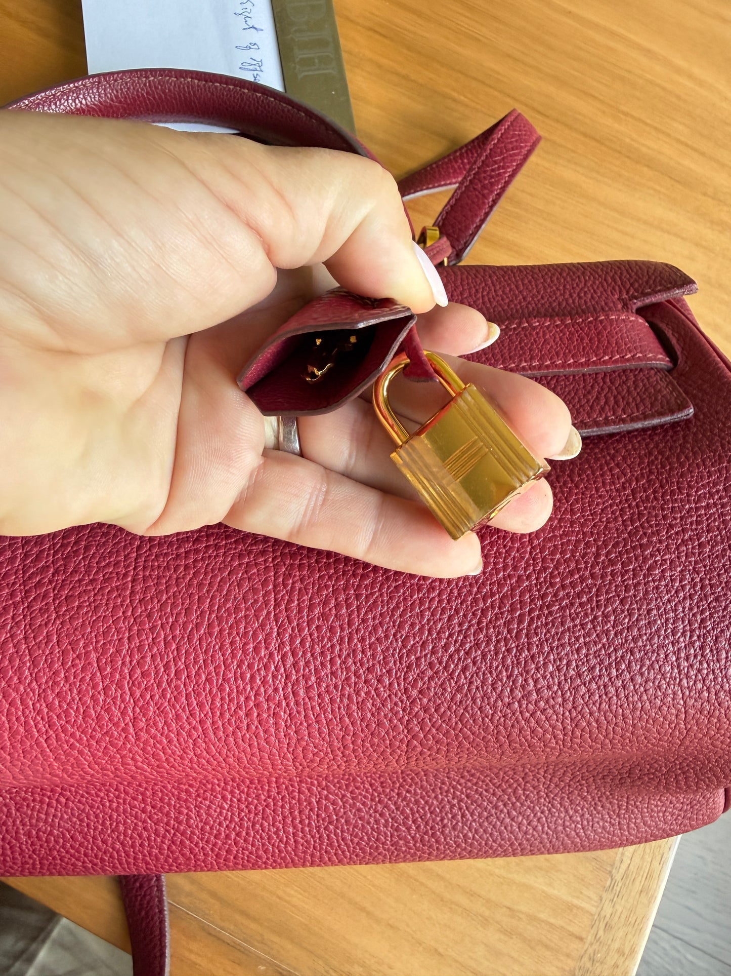 Hermes’ Kelly 35 Retourne Handbag in Togo Leather in Tosca Raspberry Pre-Owned