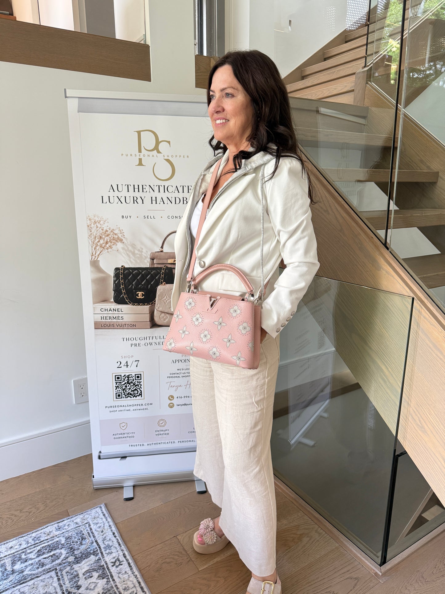 Louis Vuitton capucines in blush pink shown on woman carried as a crossbody