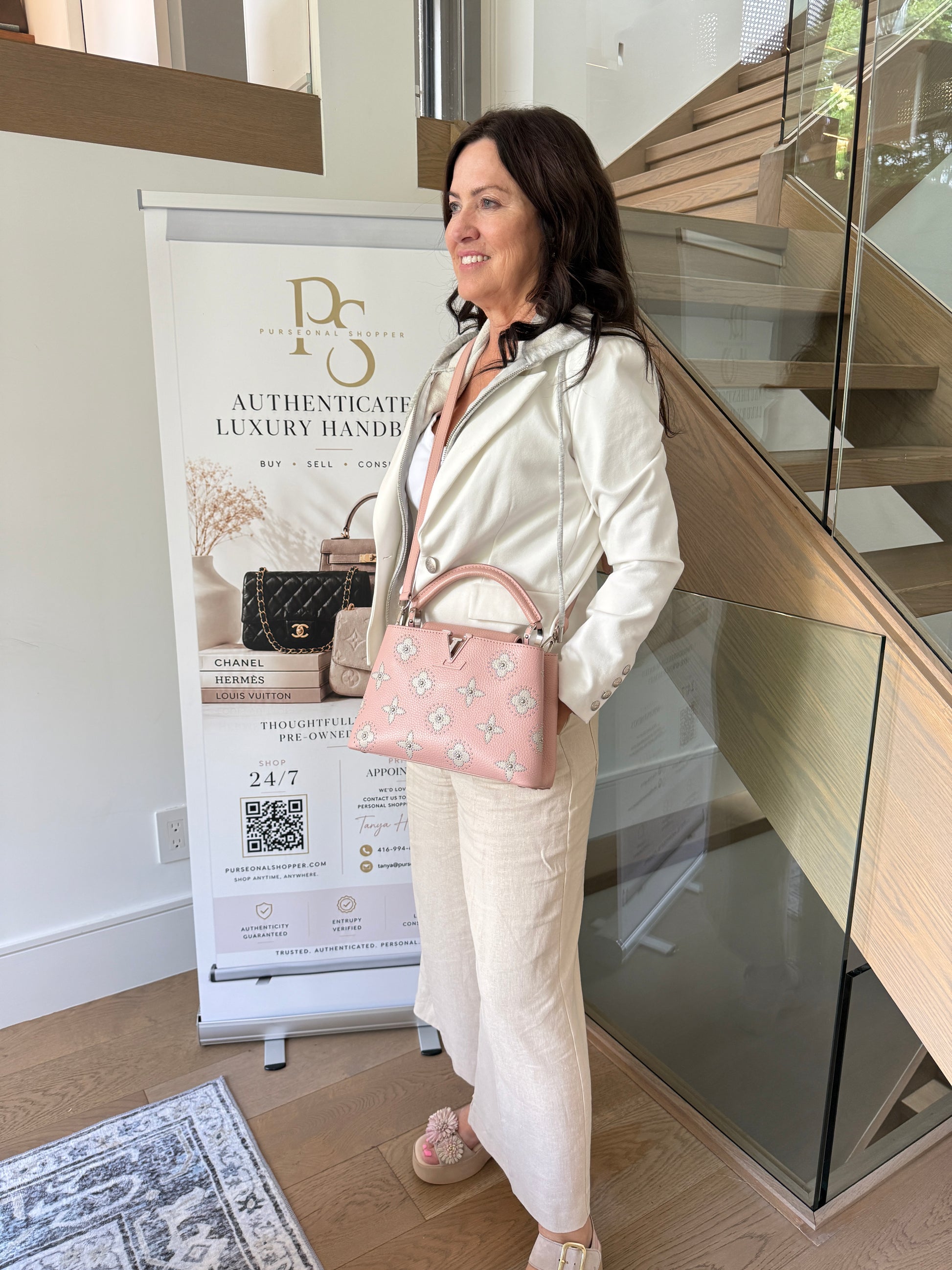 Louis Vuitton capucines in blush pink shown on woman carried as a crossbody
