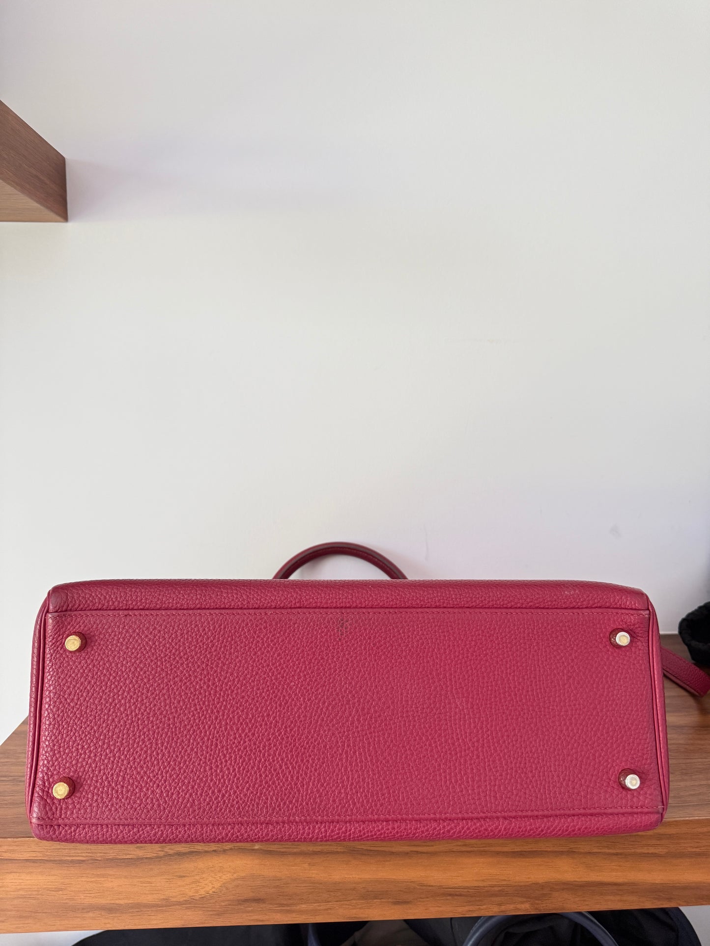 Hermes’ Kelly 35 Retourne Handbag in Togo Leather in Tosca Raspberry Pre-Owned