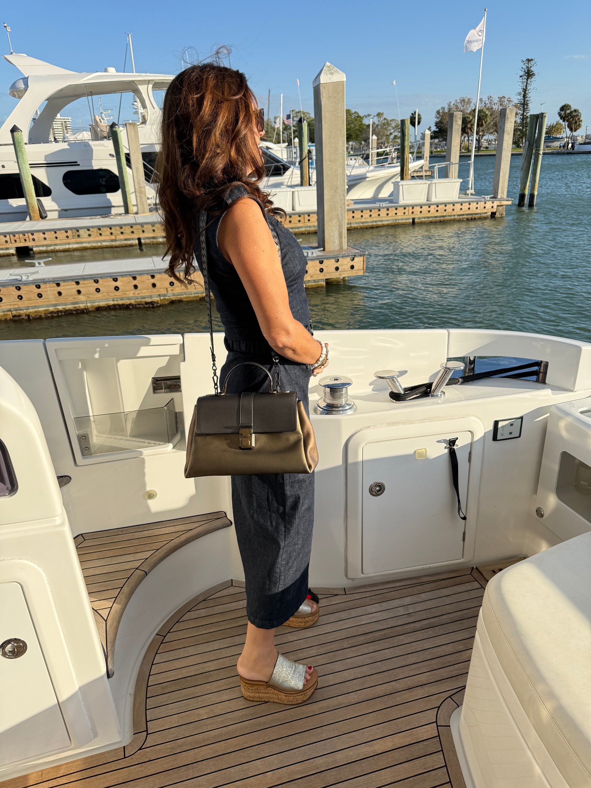 Bottega Veneta Piazza Top Handle handbag in metallic tri colour shown on woman authentic and preowned from purseonalshopper