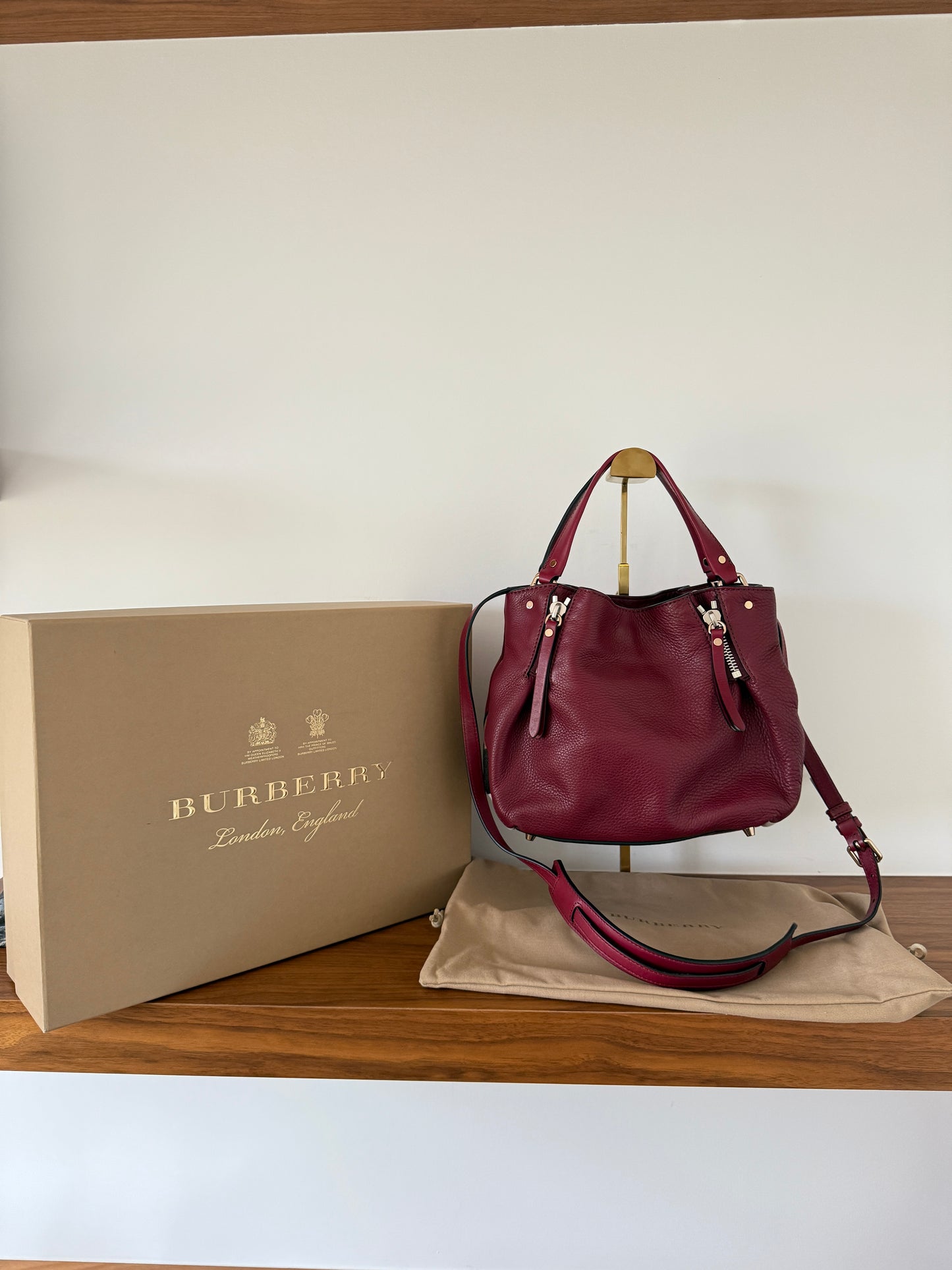 Burberry Maidstone Handbag in Burgundy leather with Burberry check accents on sides in like new condition with box and dustbag Purseonal shopper 