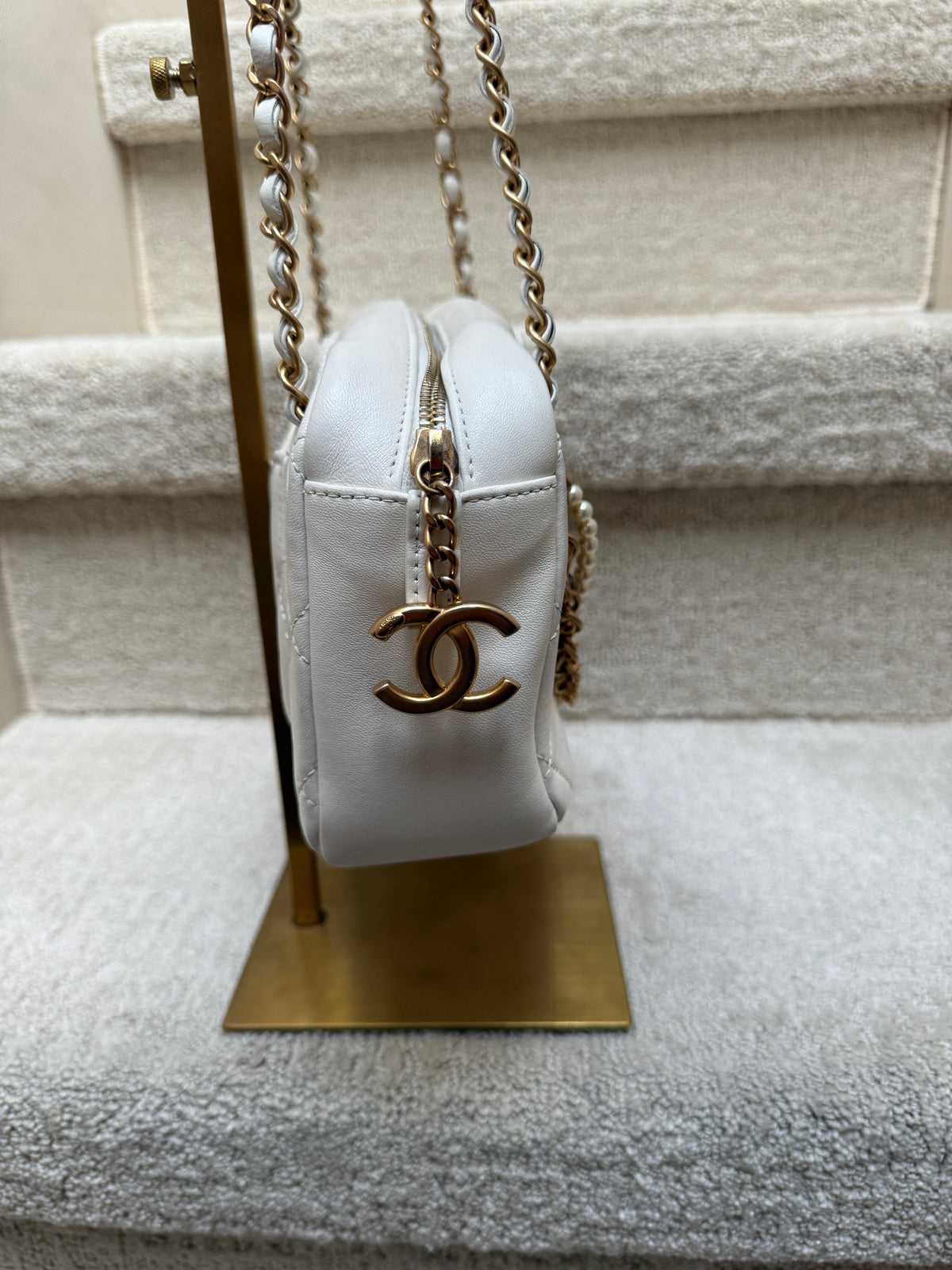 Cfhanel white all about chains side view with cc zipper pull in gold available for sale used excellent condition
