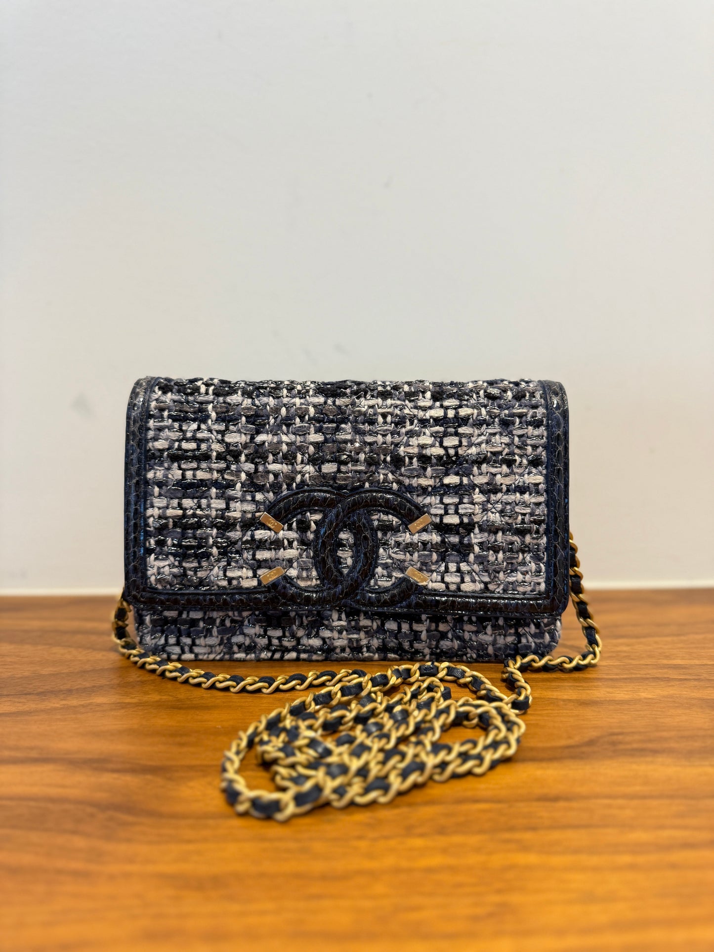 Chanel wallet on chain made of tweed with watersnake trim and gold hardware in like new used condition