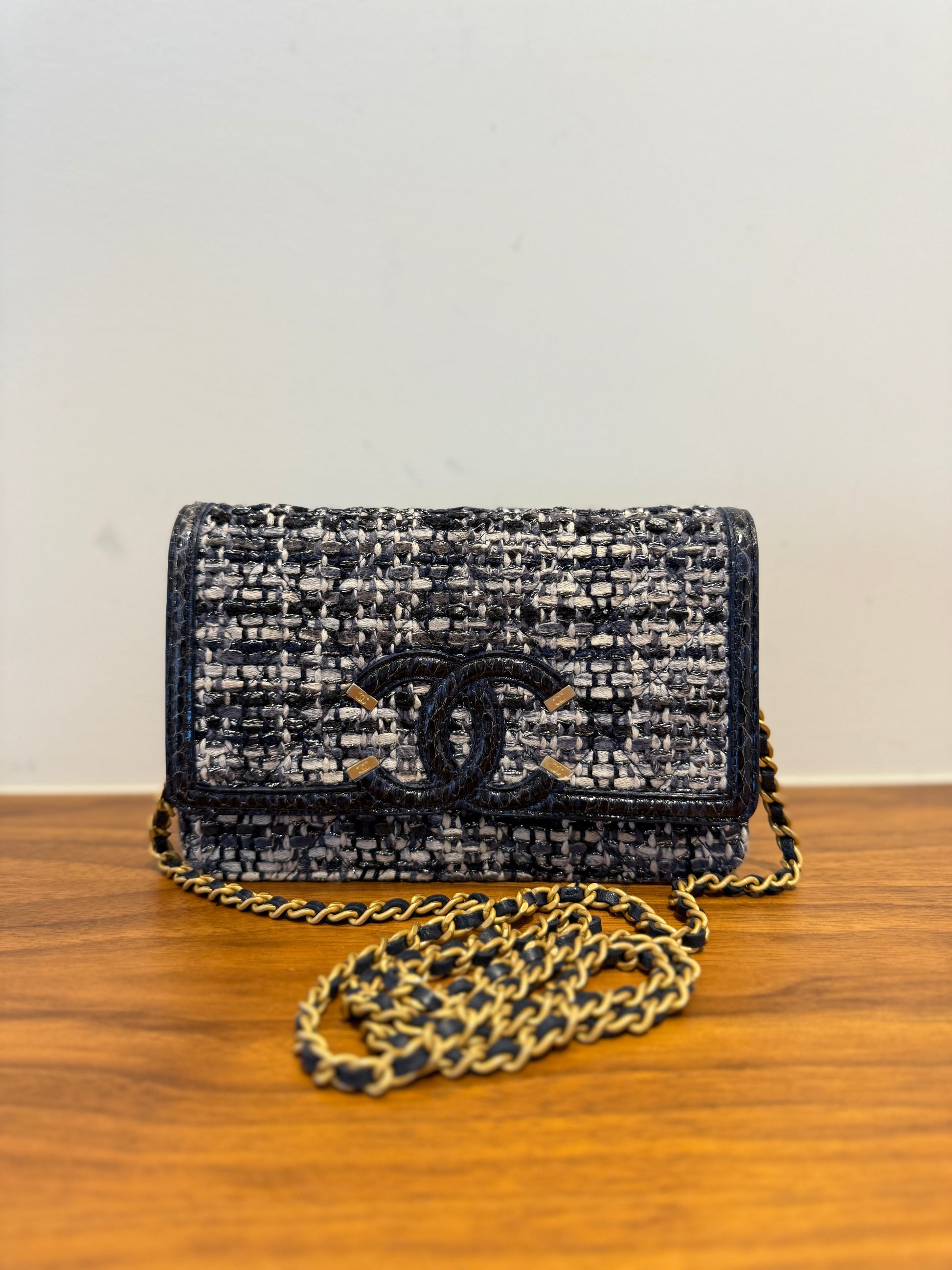 Chanel wallet on chain made of tweed with watersnake trim and gold hardware in like new used condition