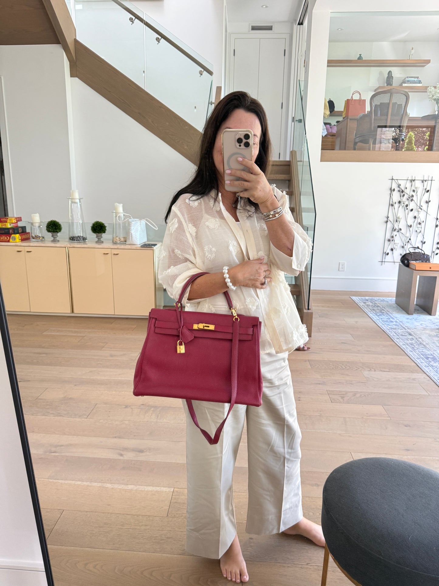 Hermes’ Kelly 35 Retourne Handbag in Togo Leather in Tosca Raspberry Pre-Owned