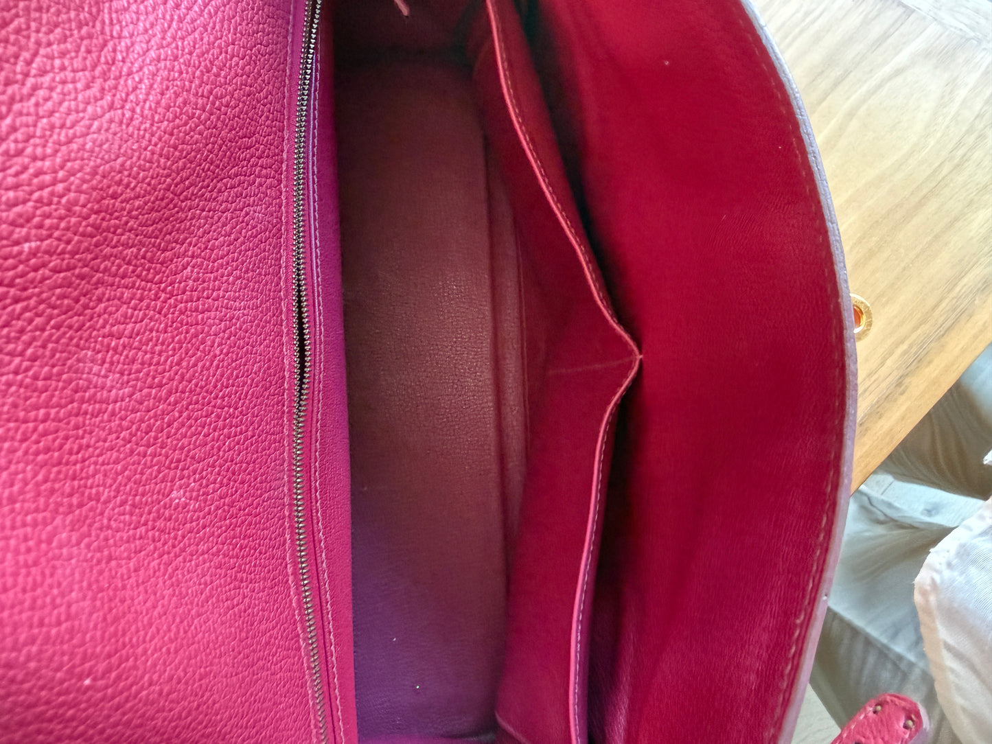 Hermes’ Kelly 35 Retourne Handbag in Togo Leather in Tosca Raspberry Pre-Owned