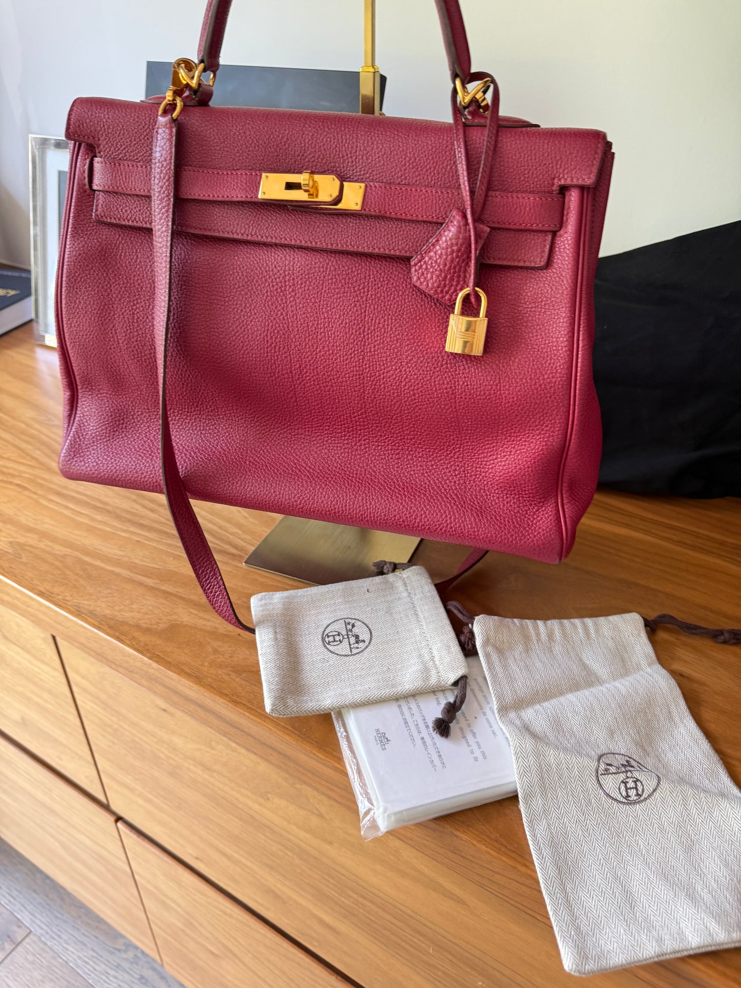 Hermes’ Kelly 35 Retourne Handbag in Togo Leather in Tosca Raspberry Pre-Owned