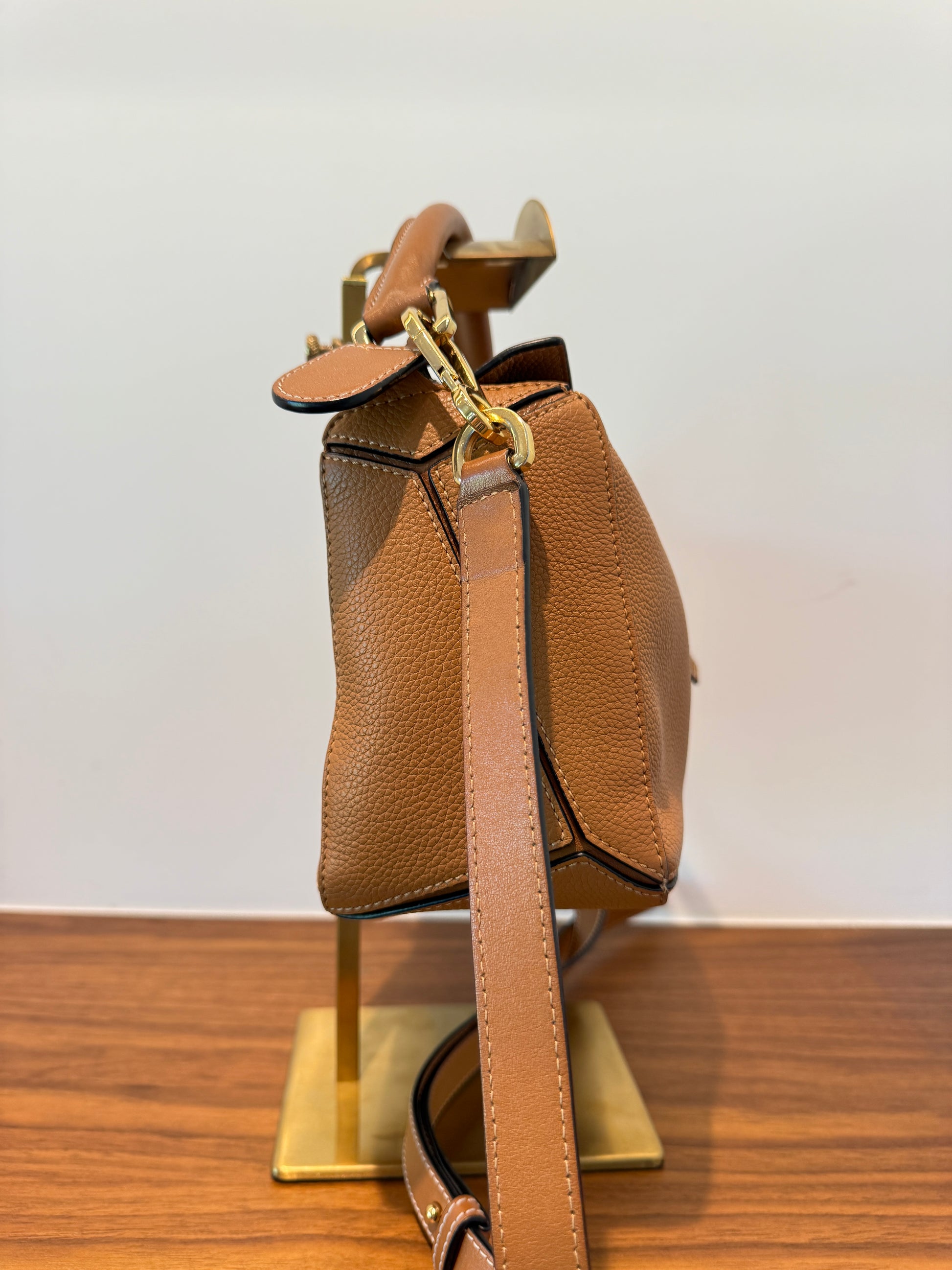 Loewe puzzle bag in brown other side view with optional shoulder strap