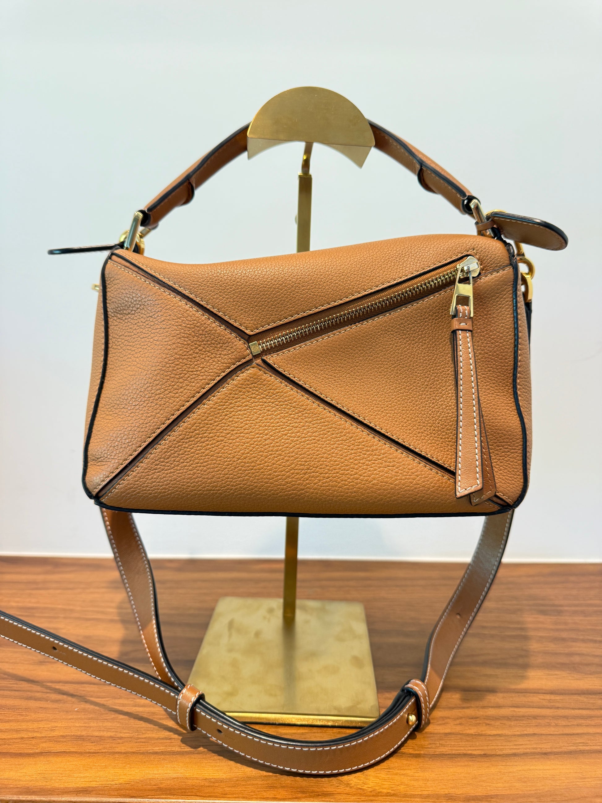 Loewe puzzle bag in camel colour view of back side of handbag