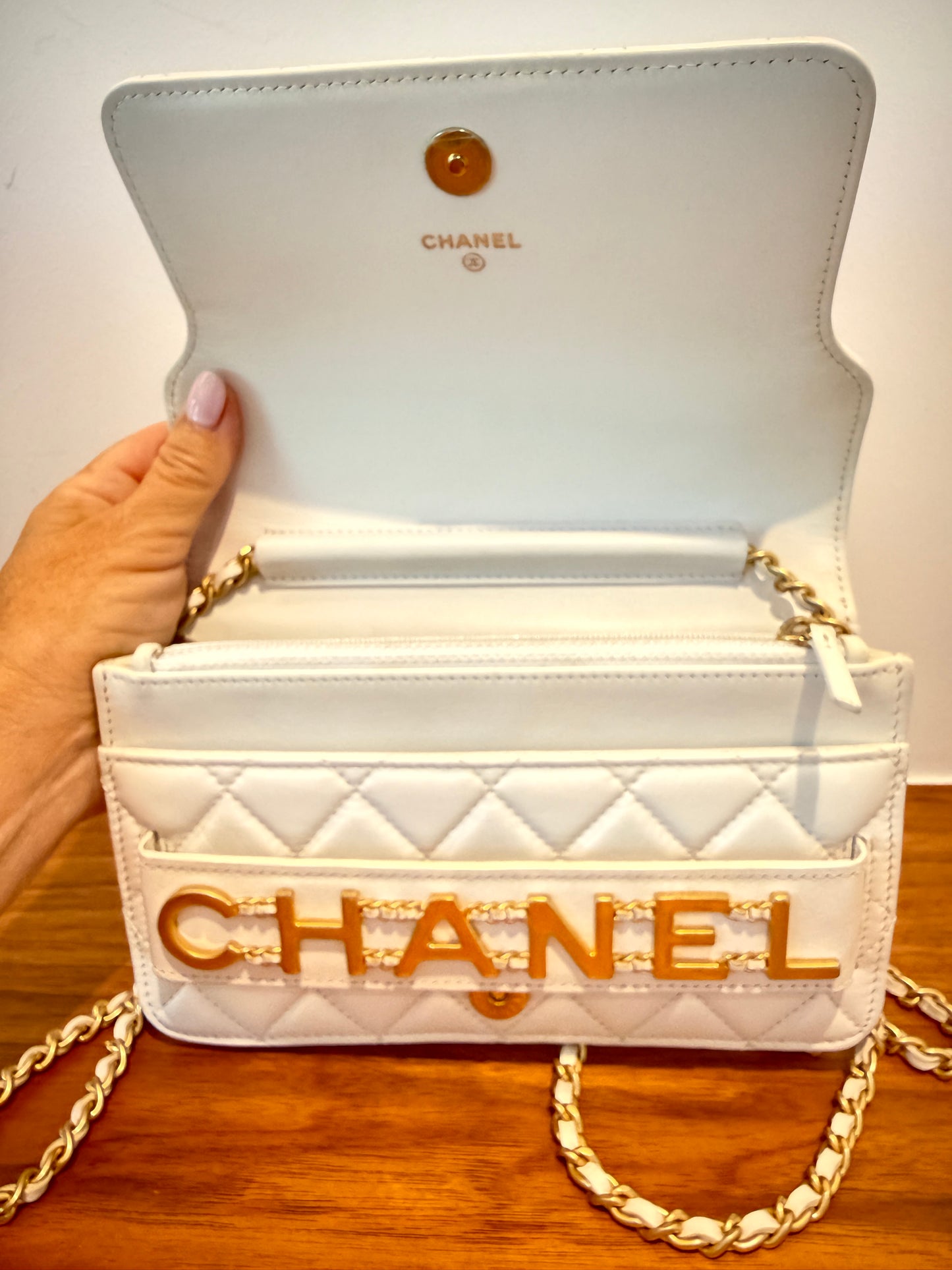 Chanel woc in white lambskin view under flap