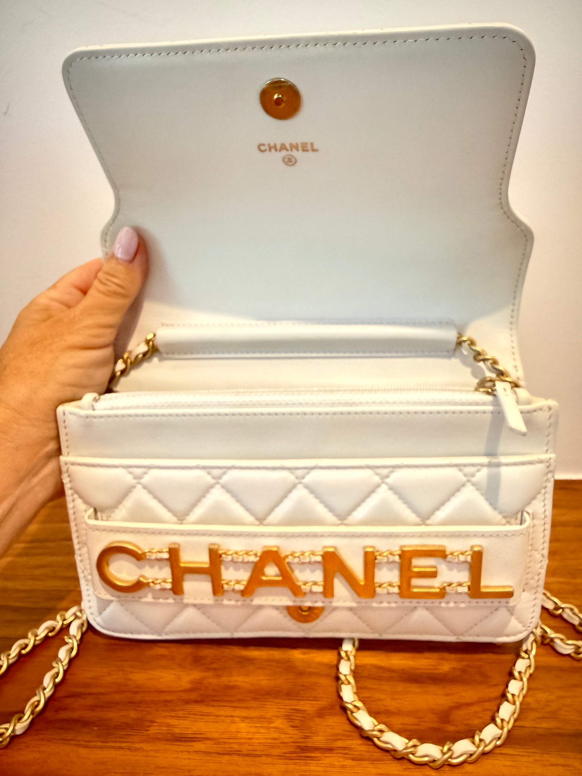Chanel woc in white lambskin view under flap