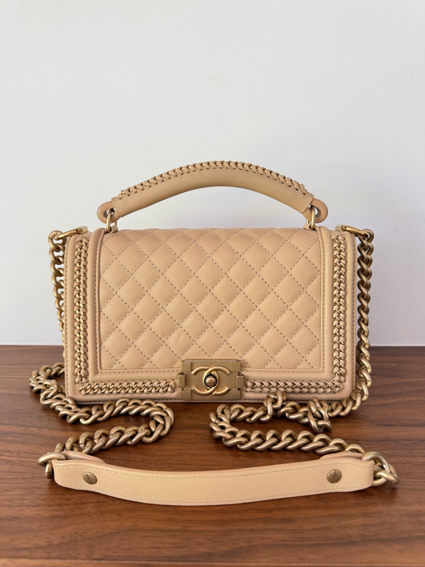 Chanel boy bag size medium with top handle in beige leather with gold hardware authentic preloved