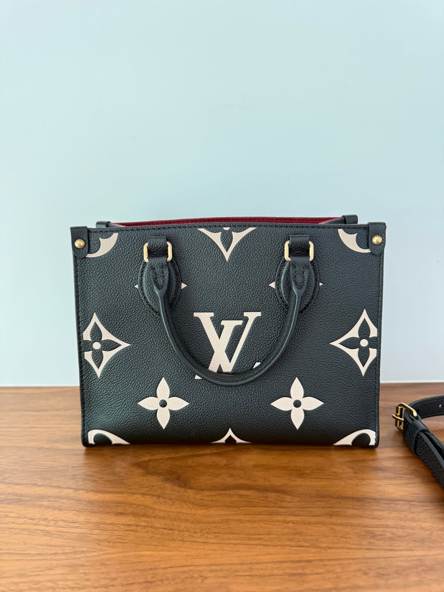 Louis Vuitton On the Go pm size in black and beige resale used