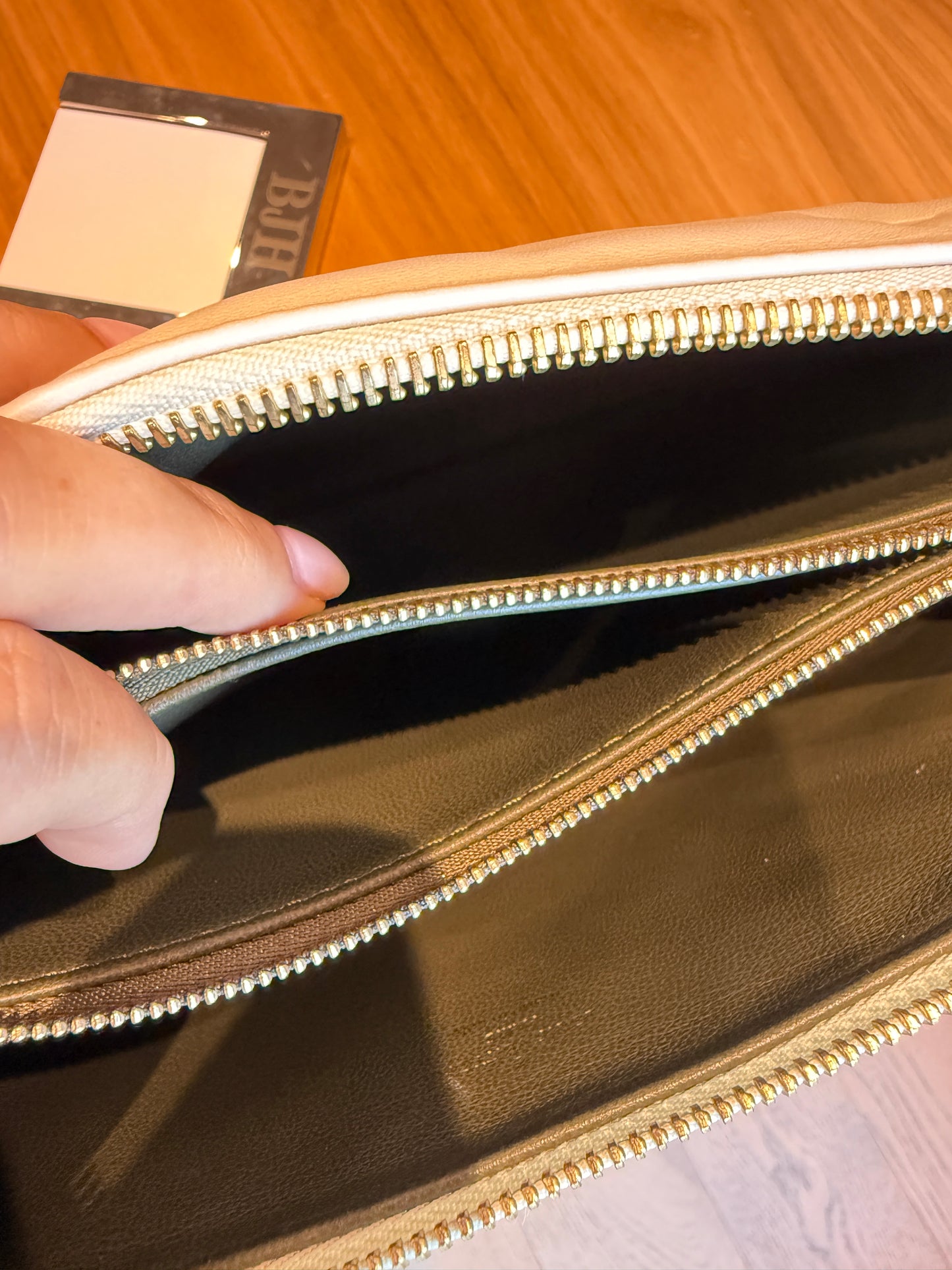 close up of leather interior on louis vuitton coussin purse