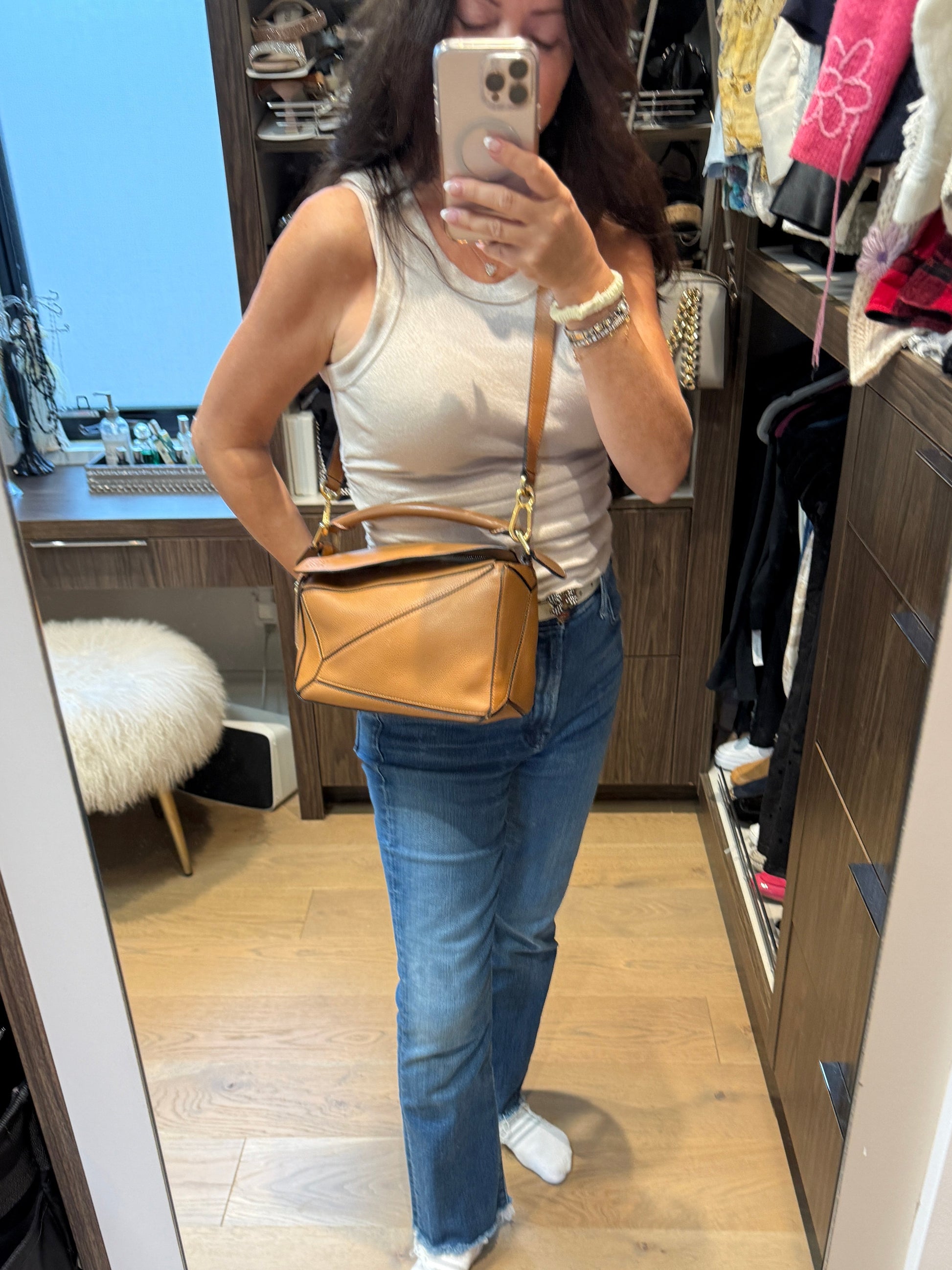 Loewe puzzle bag small size shown on woman worn as a crossbody resale
