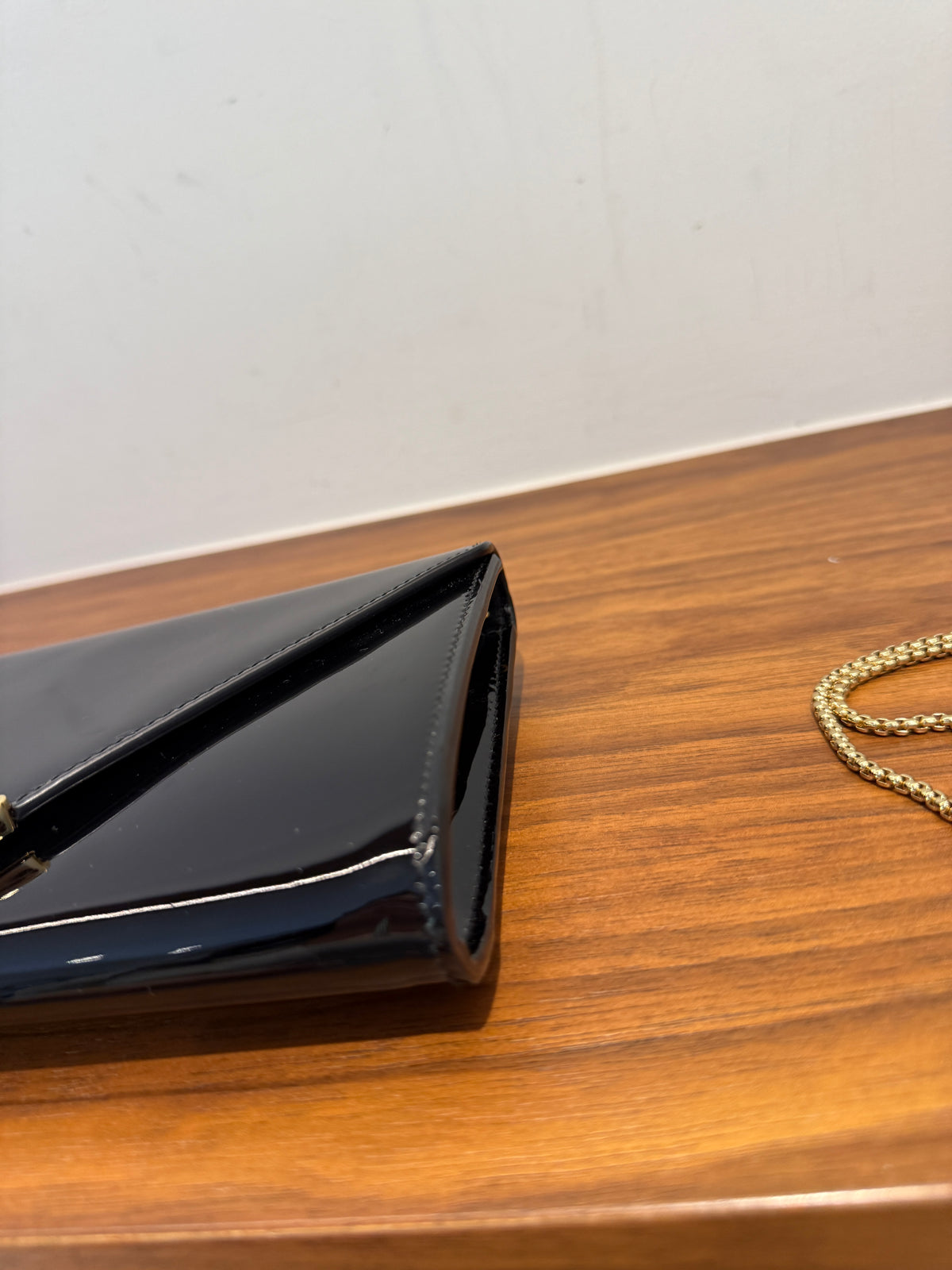 Prada Vernice Metal Triangle Logo Clutch in Black Patent Leather
