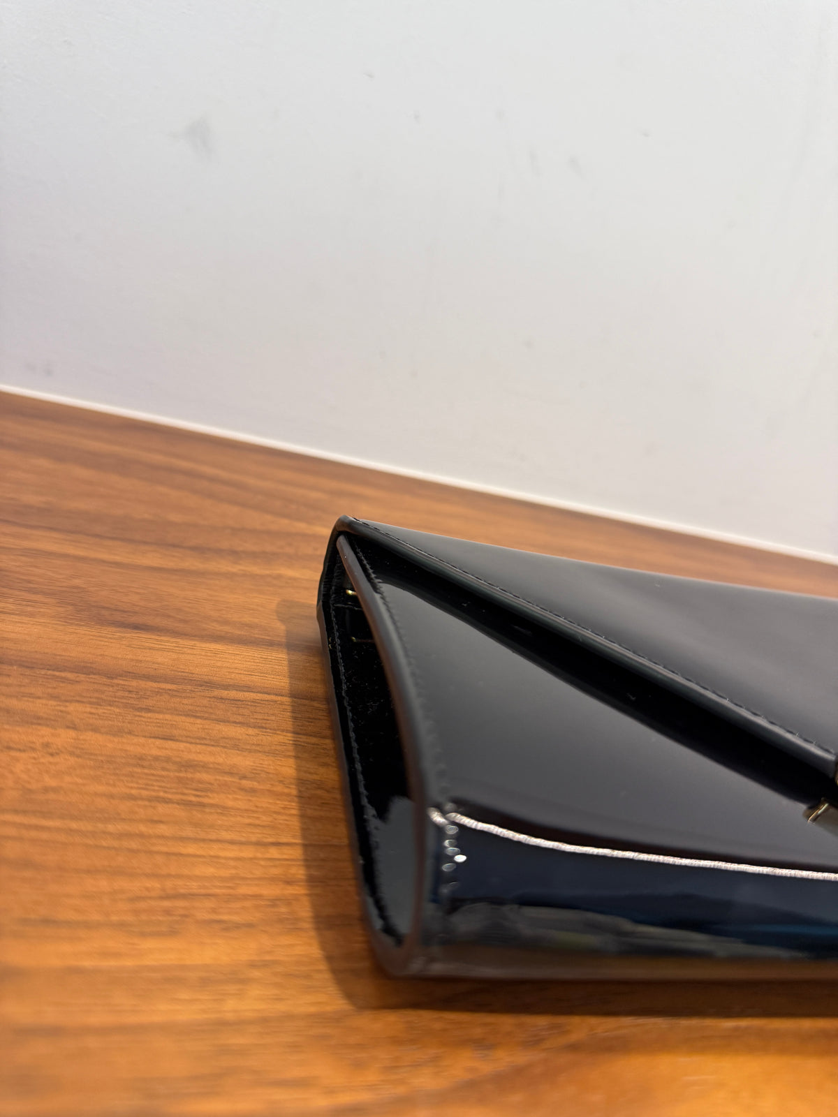 Prada Vernice Metal Triangle Logo Clutch in Black Patent Leather