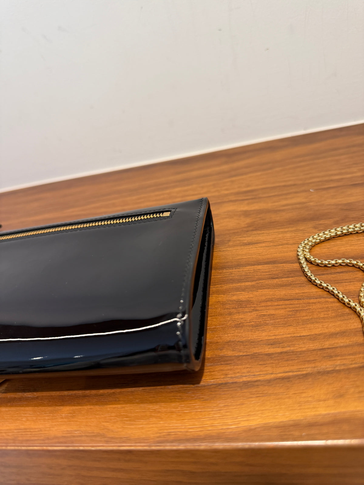 Prada Vernice Metal Triangle Logo Clutch in Black Patent Leather