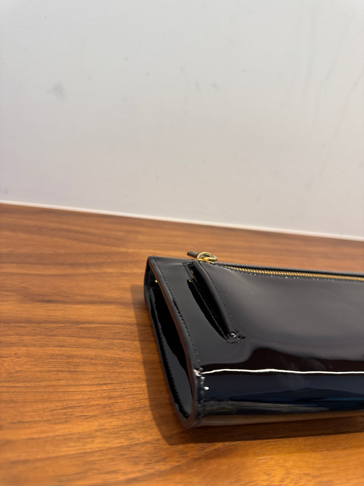 Prada Vernice Metal Triangle Logo Clutch in Black Patent Leather