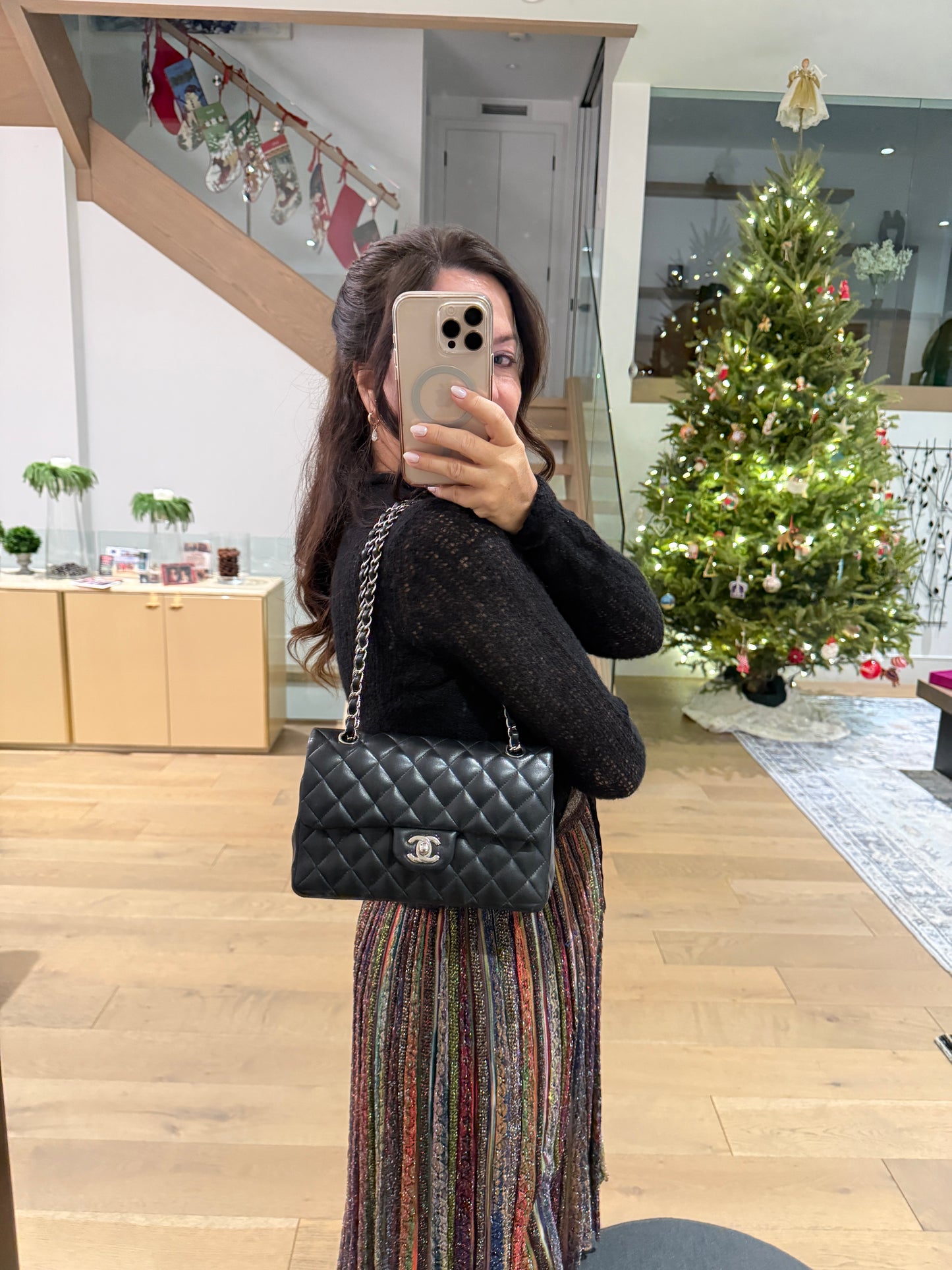 chanel classic double flap small as shown on the shoulder of a woman