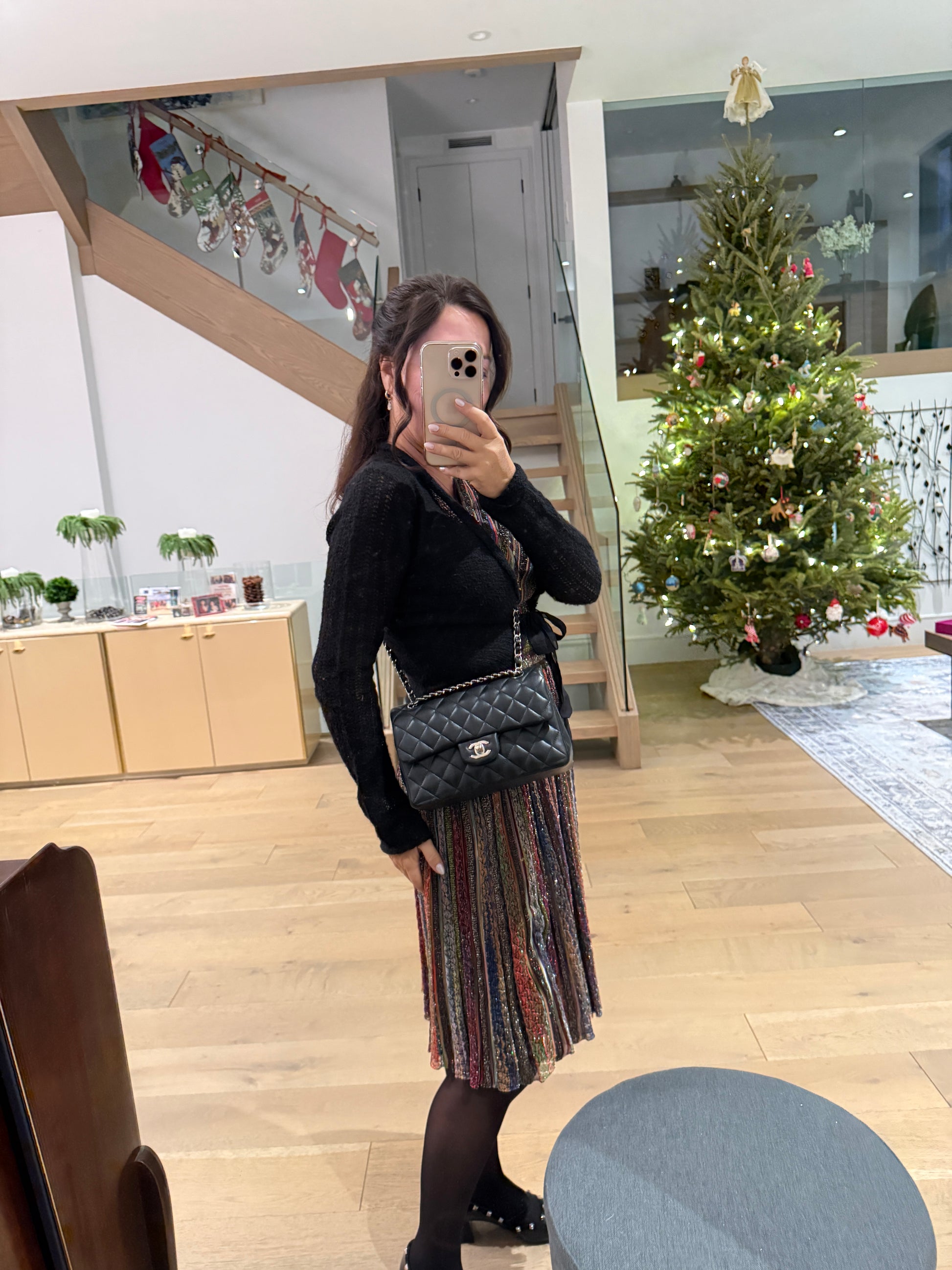 chanel classic double flap small as worn as a cross body on a woman