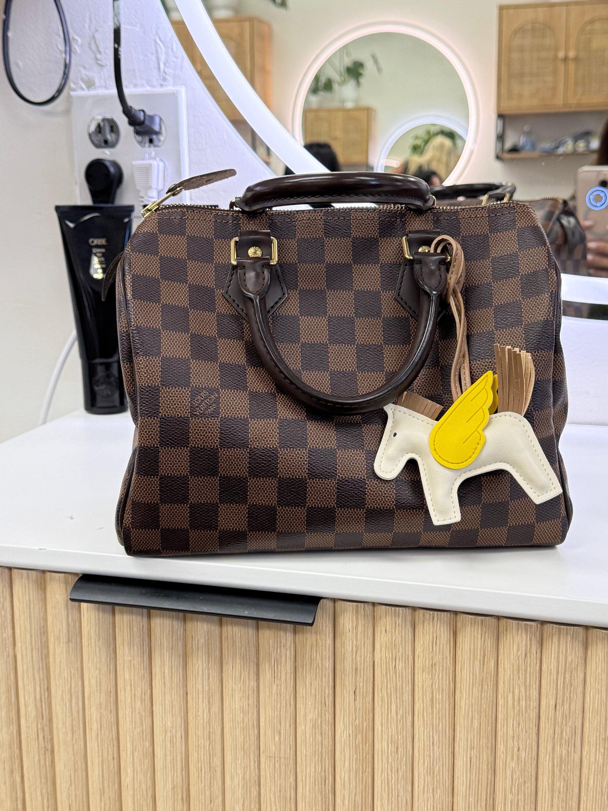 Louis Vuitton speedy 25 shown with pony charm