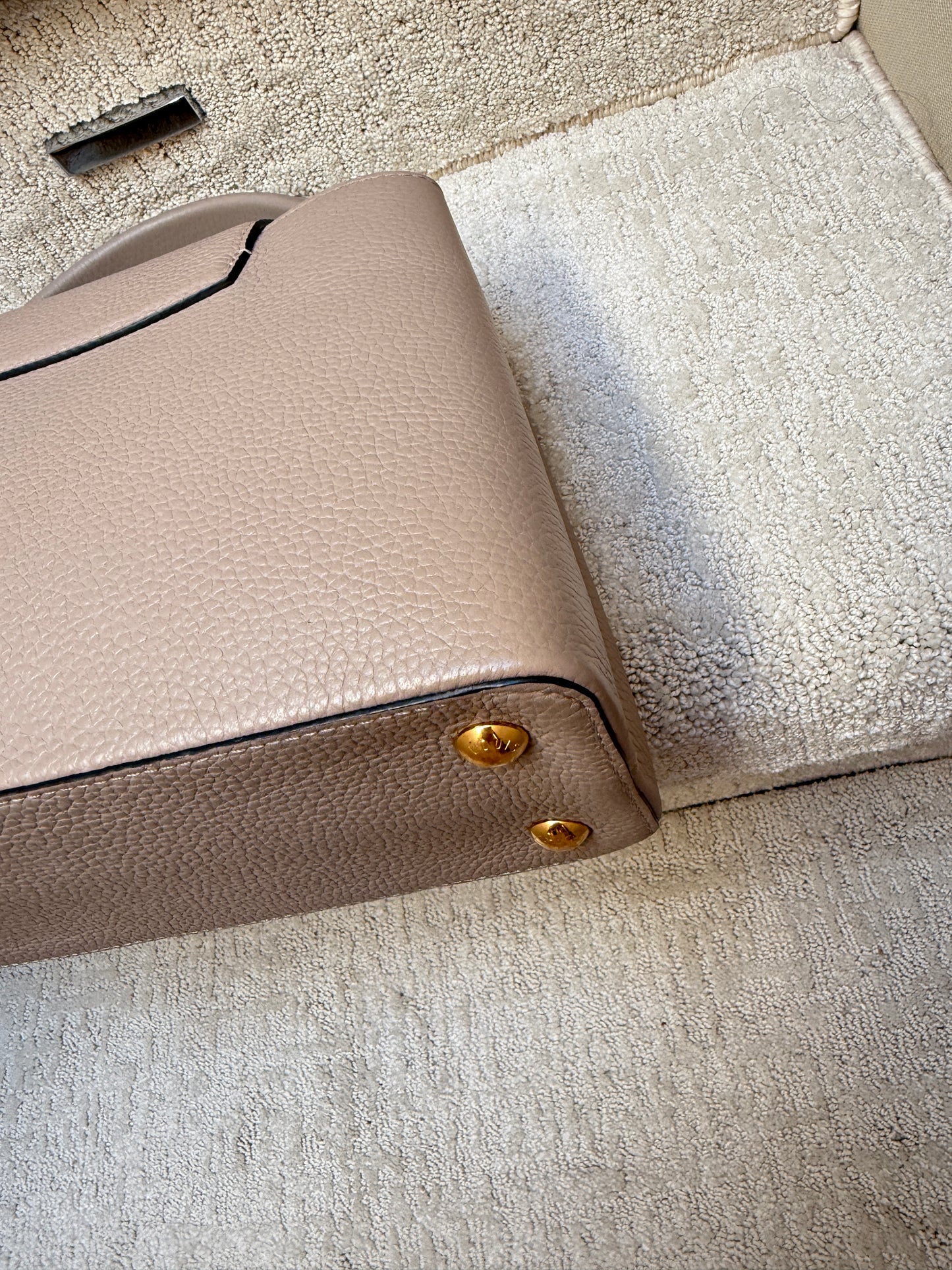 Louis Vuitton Taurillon Capucines PM in Galet or taupe