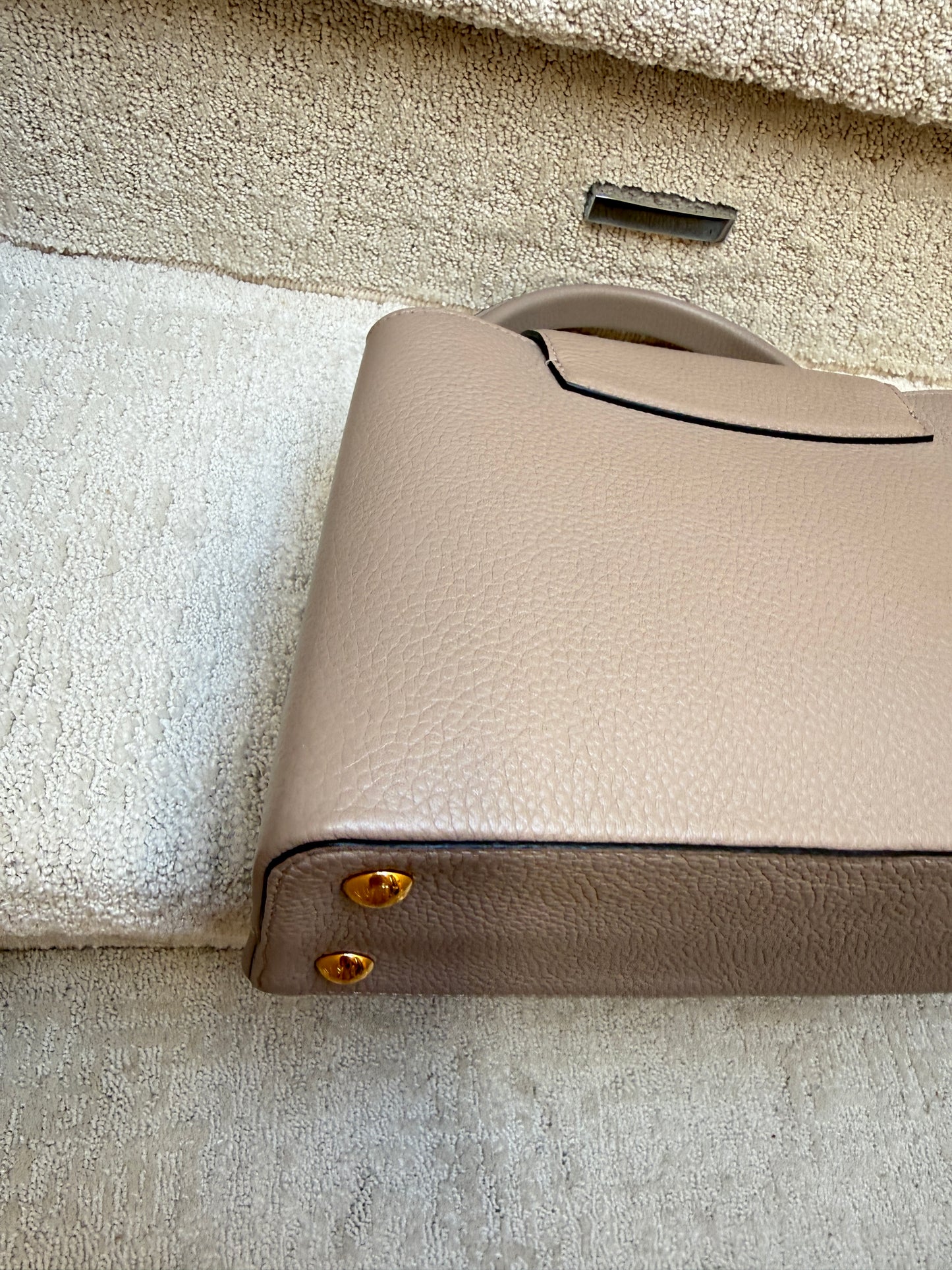 Louis Vuitton Taurillon Capucines PM in Galet or taupe
