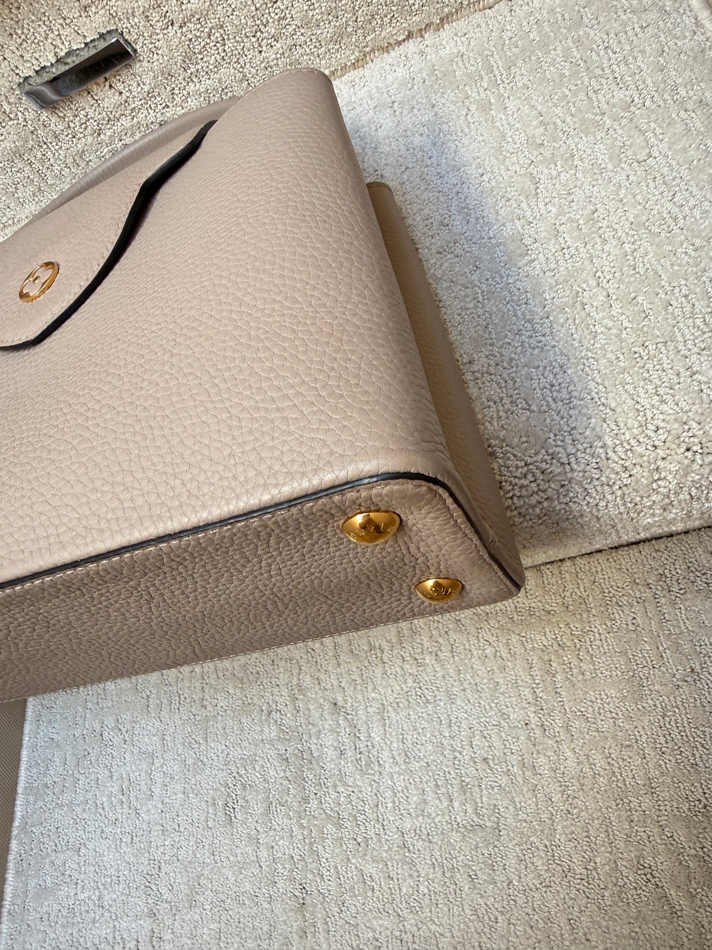 Louis Vuitton Taurillon Capucines PM in Galet or taupe