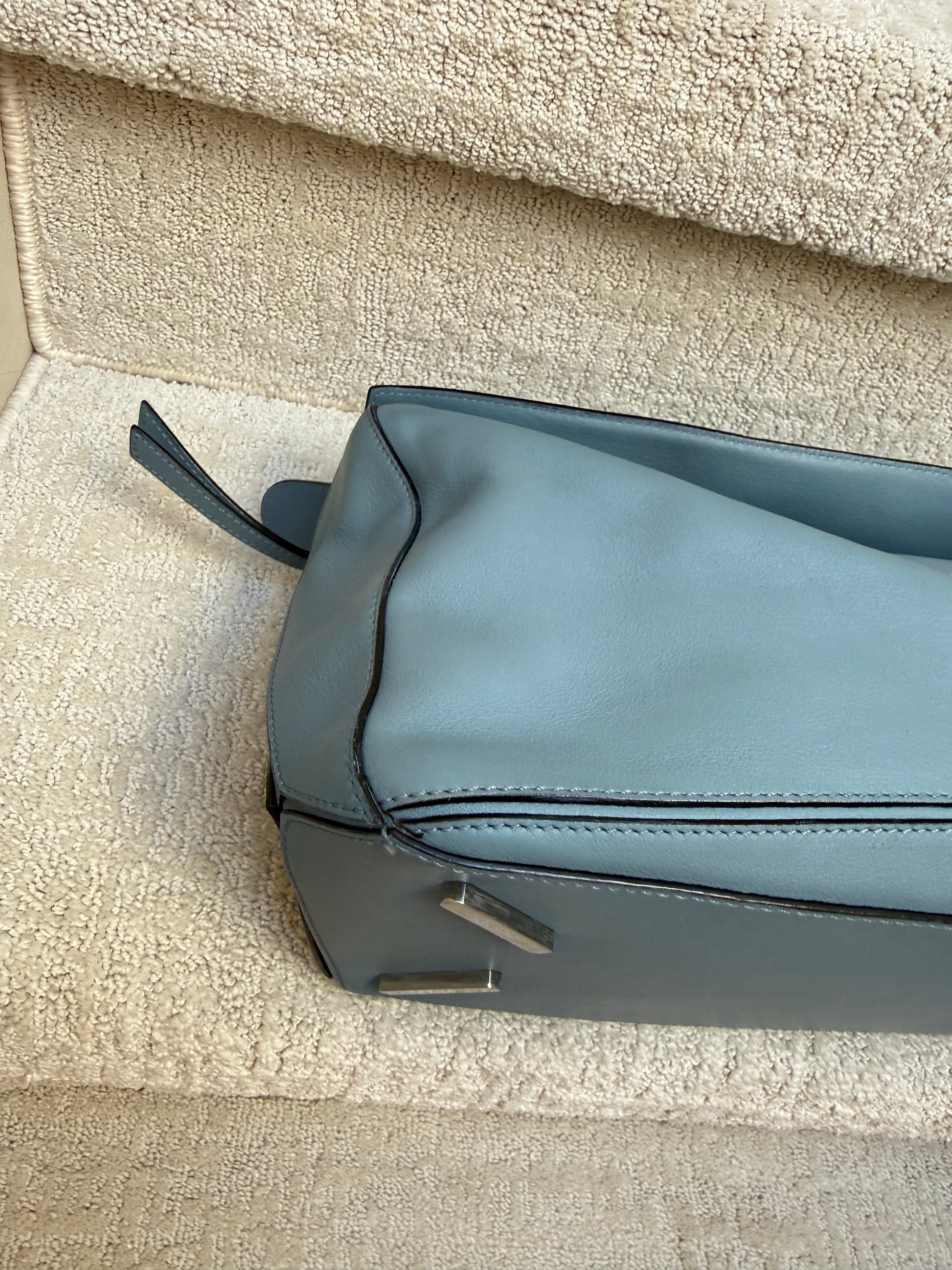 another corner photo of loewe puzzle bag blue leather with silver hardware resale