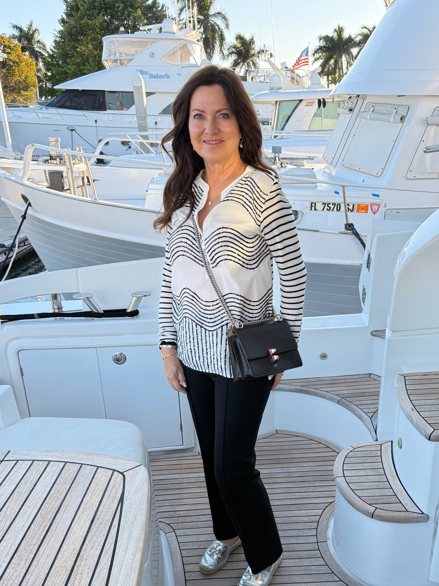 fendi kan resale handbag shown on woman wearing as a crossbody