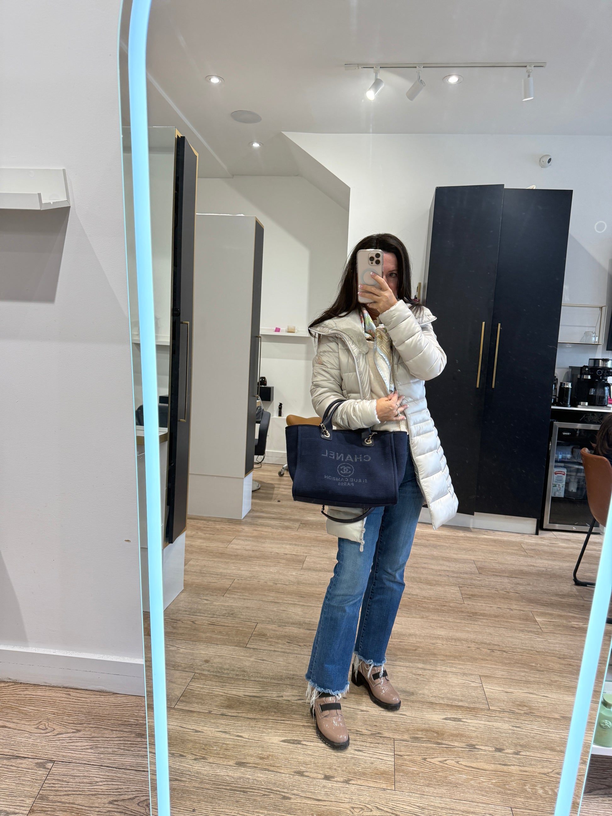 Chanel Deauville tote in navy shown on woman worn on her wrist used and sale