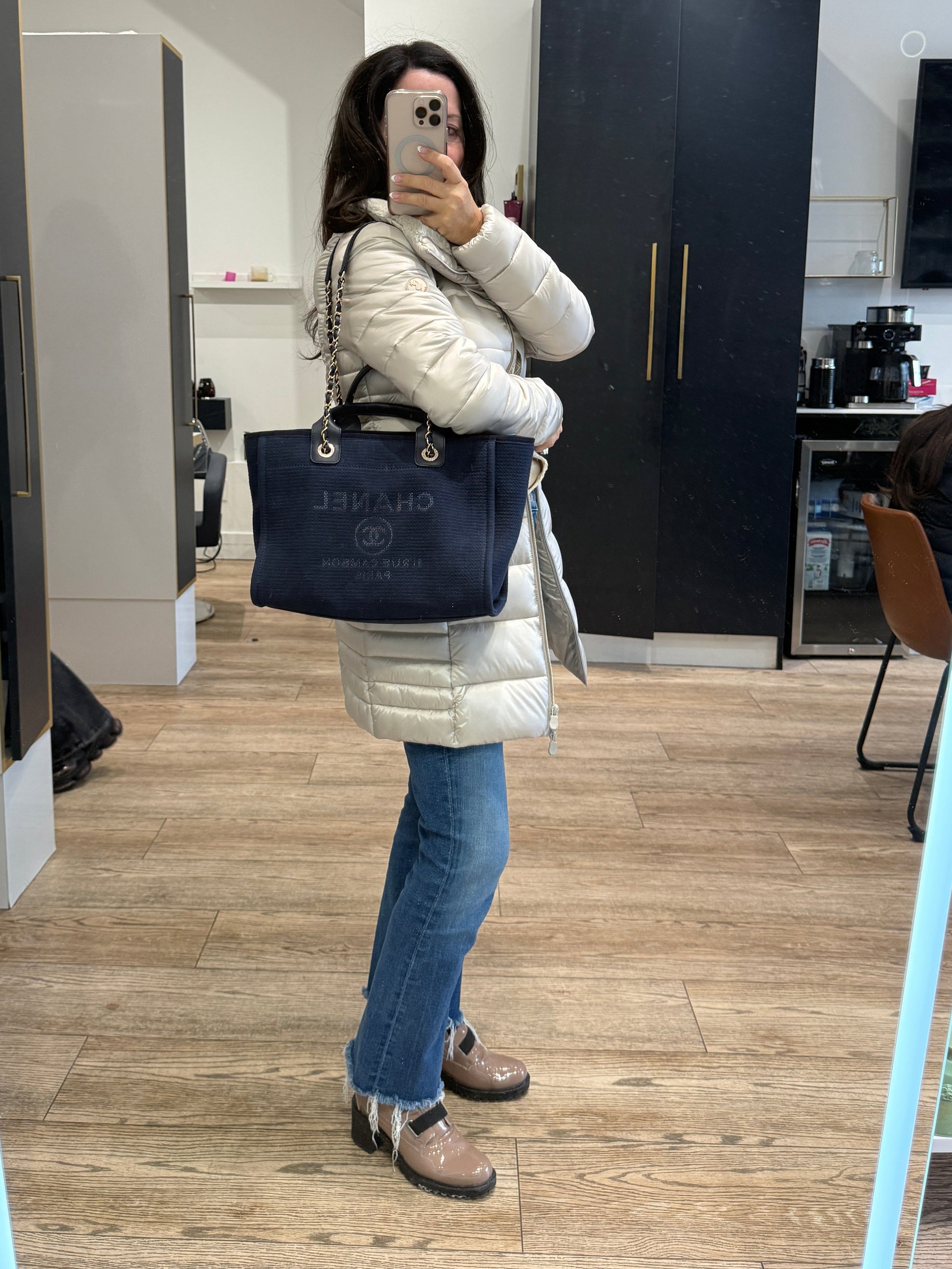 Chanel Deauville Navy luxury designer authentic tote shown carried on womans shoulder 