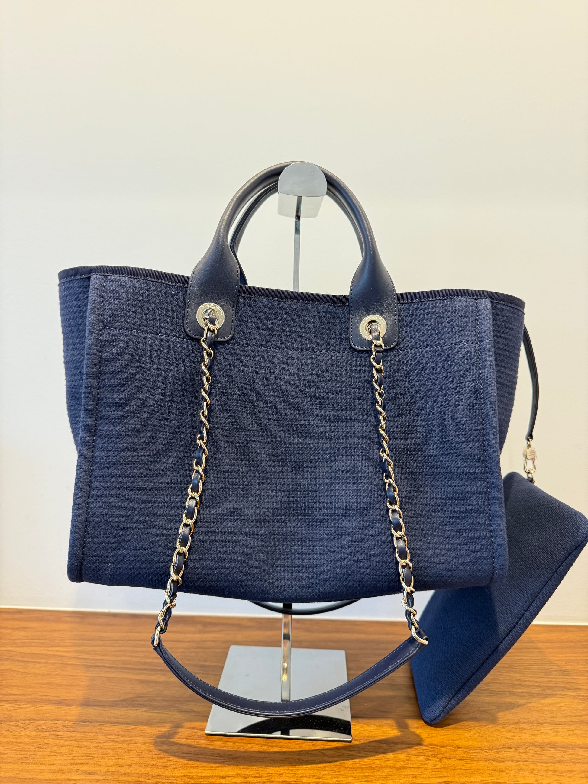 Chanel Deauville Navy tote for sale shown back side of handbag.