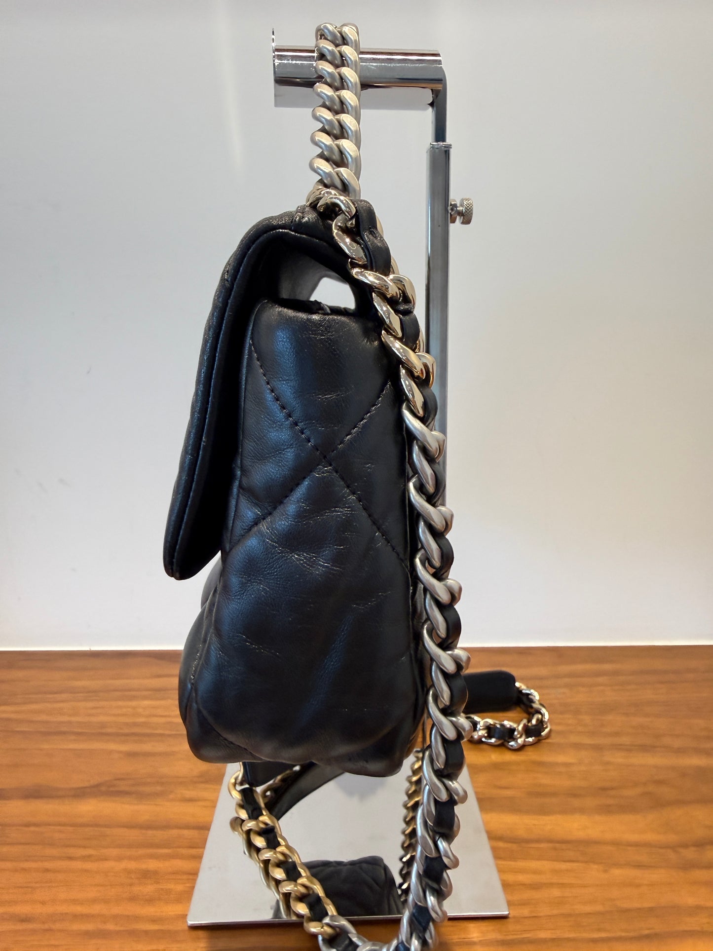 Side view of Chanel 19 purse in black for sale