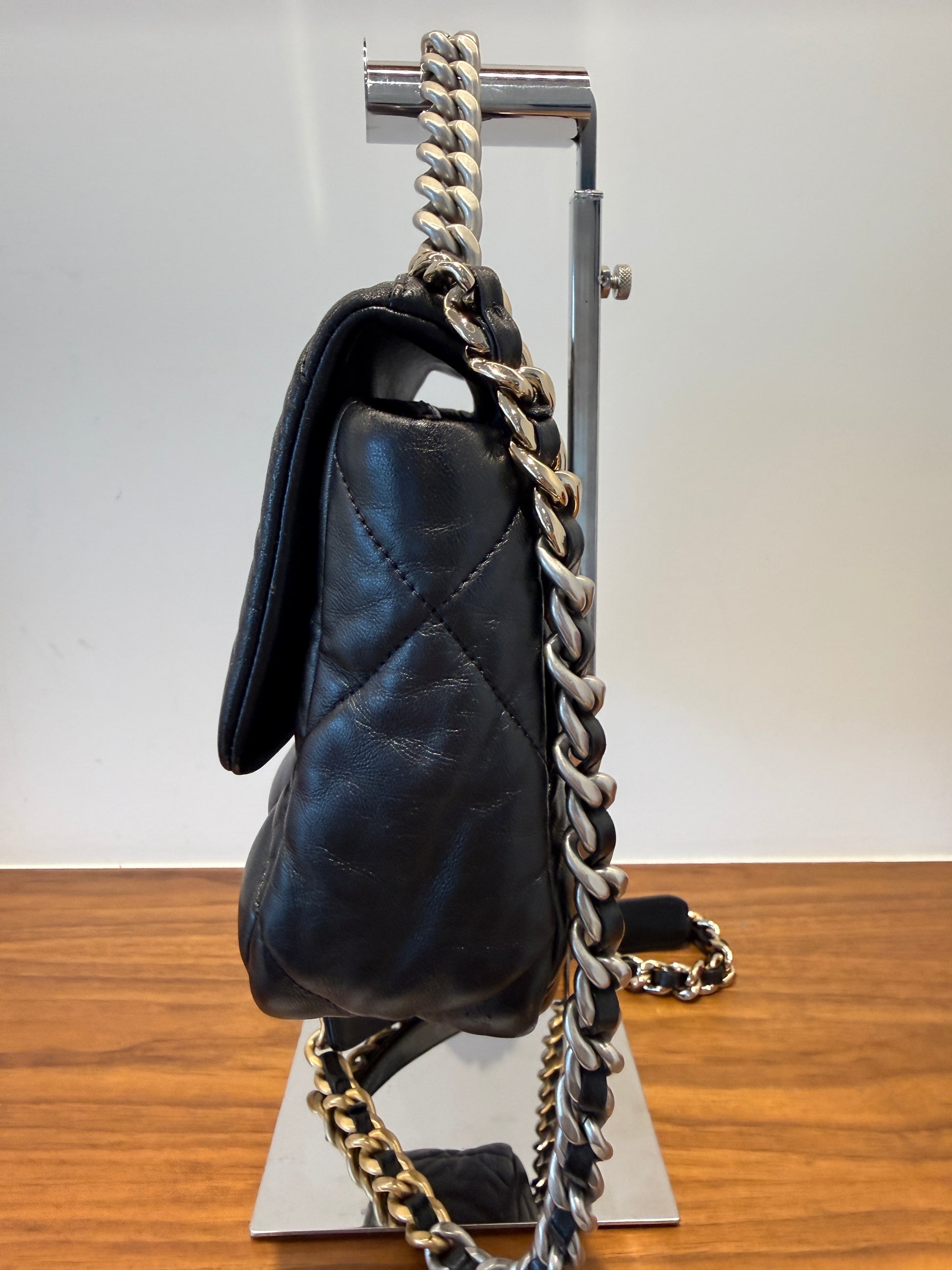 Side view of Chanel 19 purse in black for sale