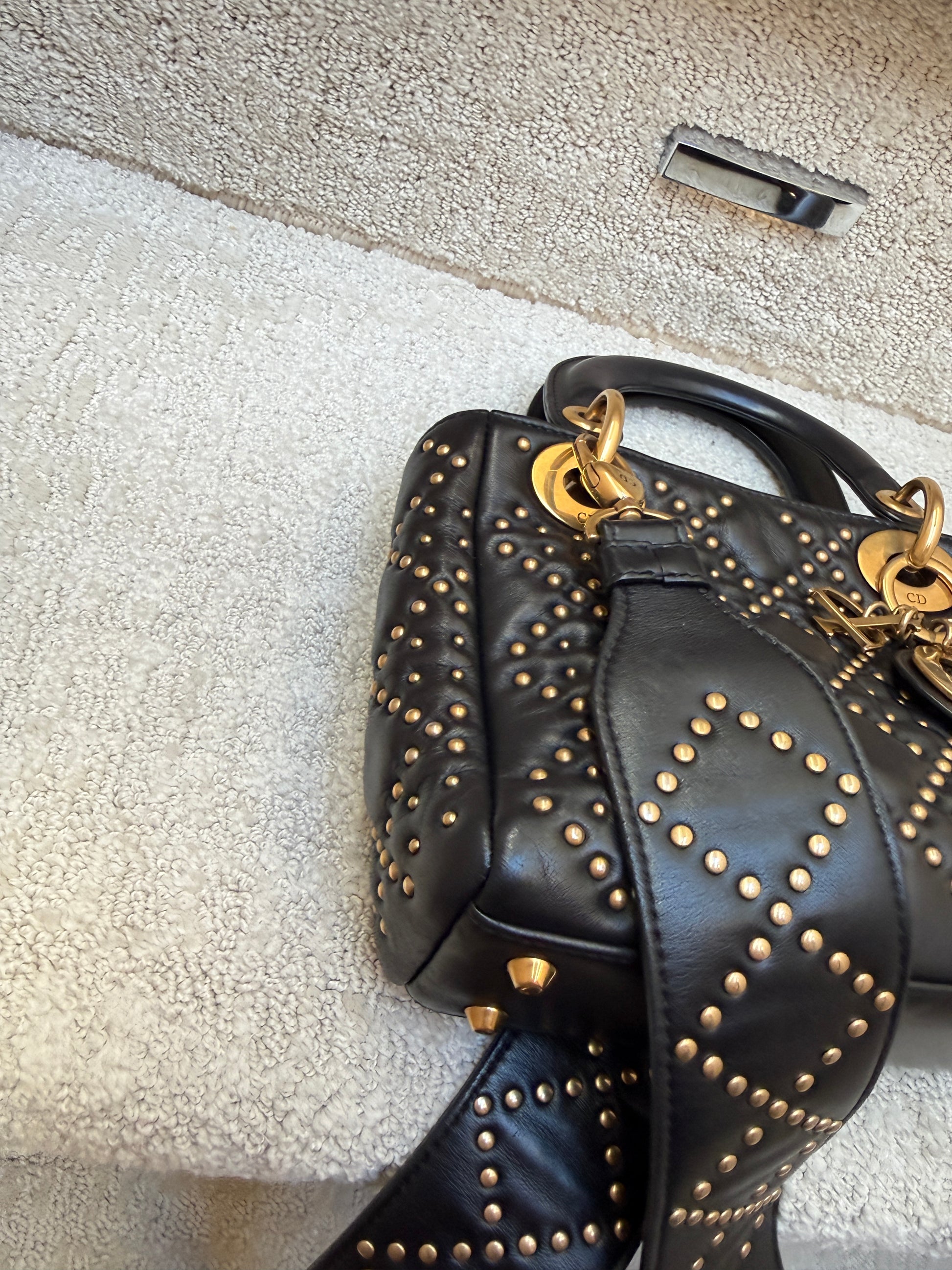 Christian Dior Mini Lady Dior gold stud detail With close up view of corner and studs on shoulder strap