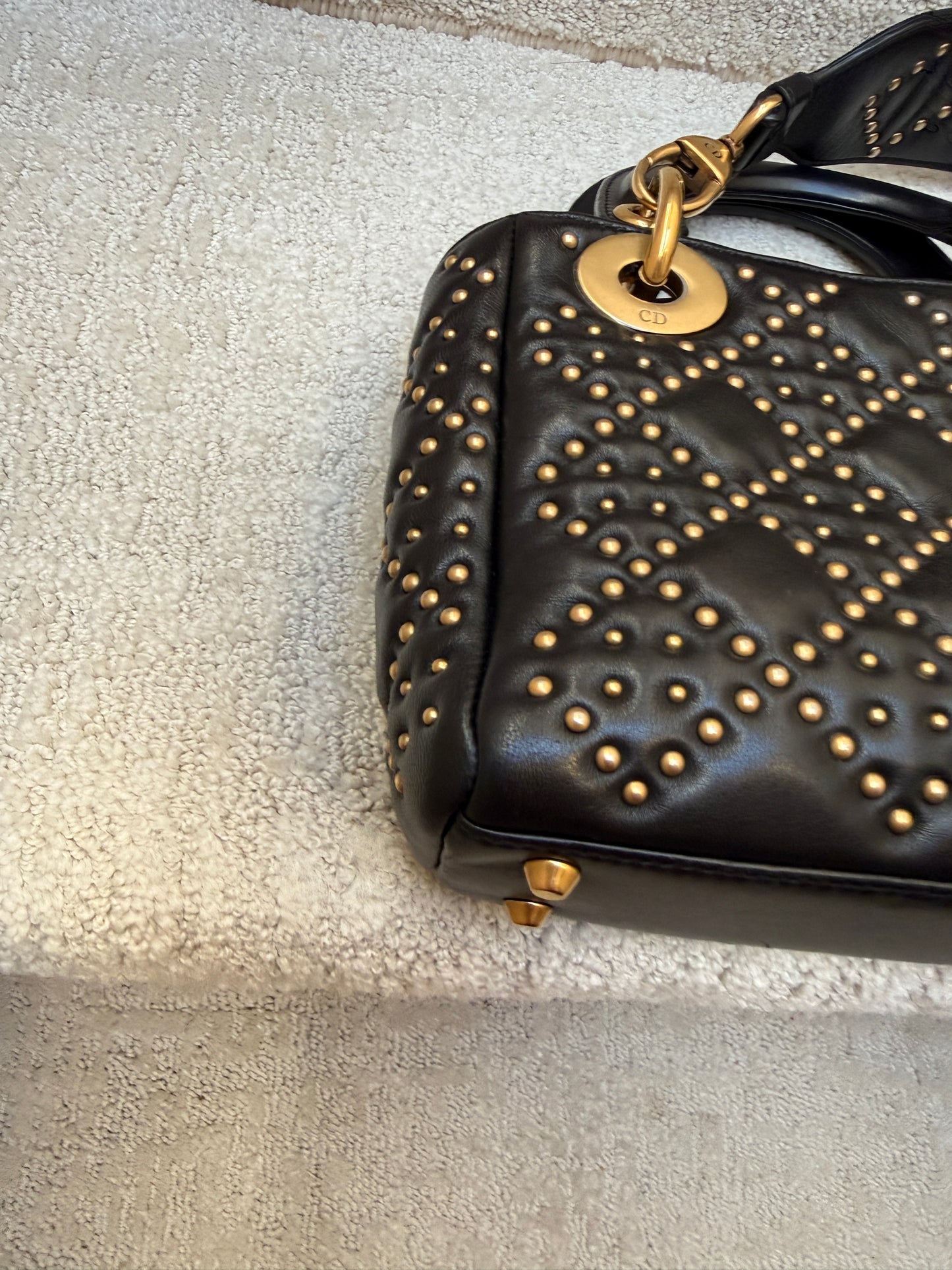 Christian Dior Mini Lady Dior gold stud detail Close up view of corner