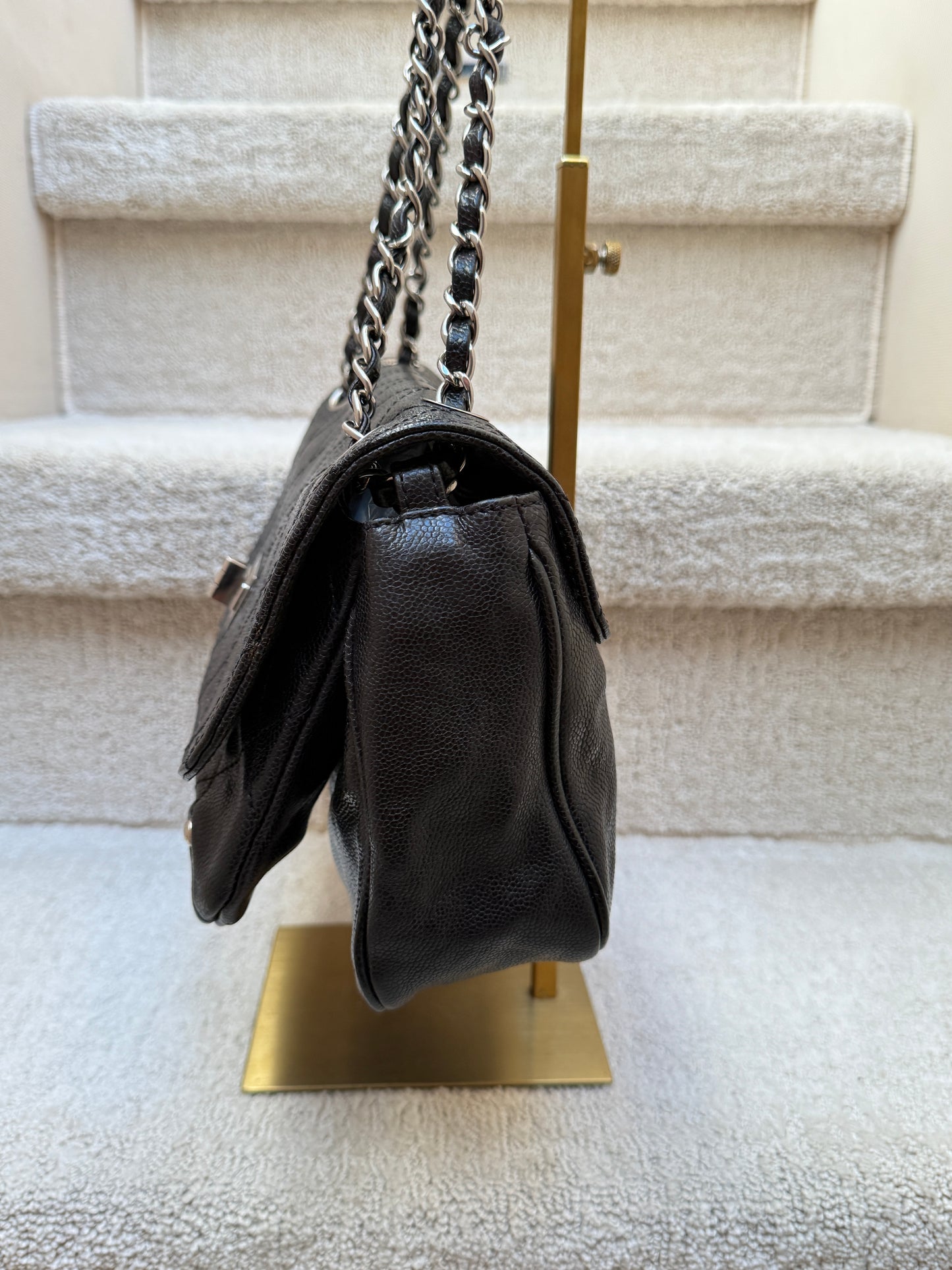 Chanel 2.55 re-issue side view of bag while stuffed