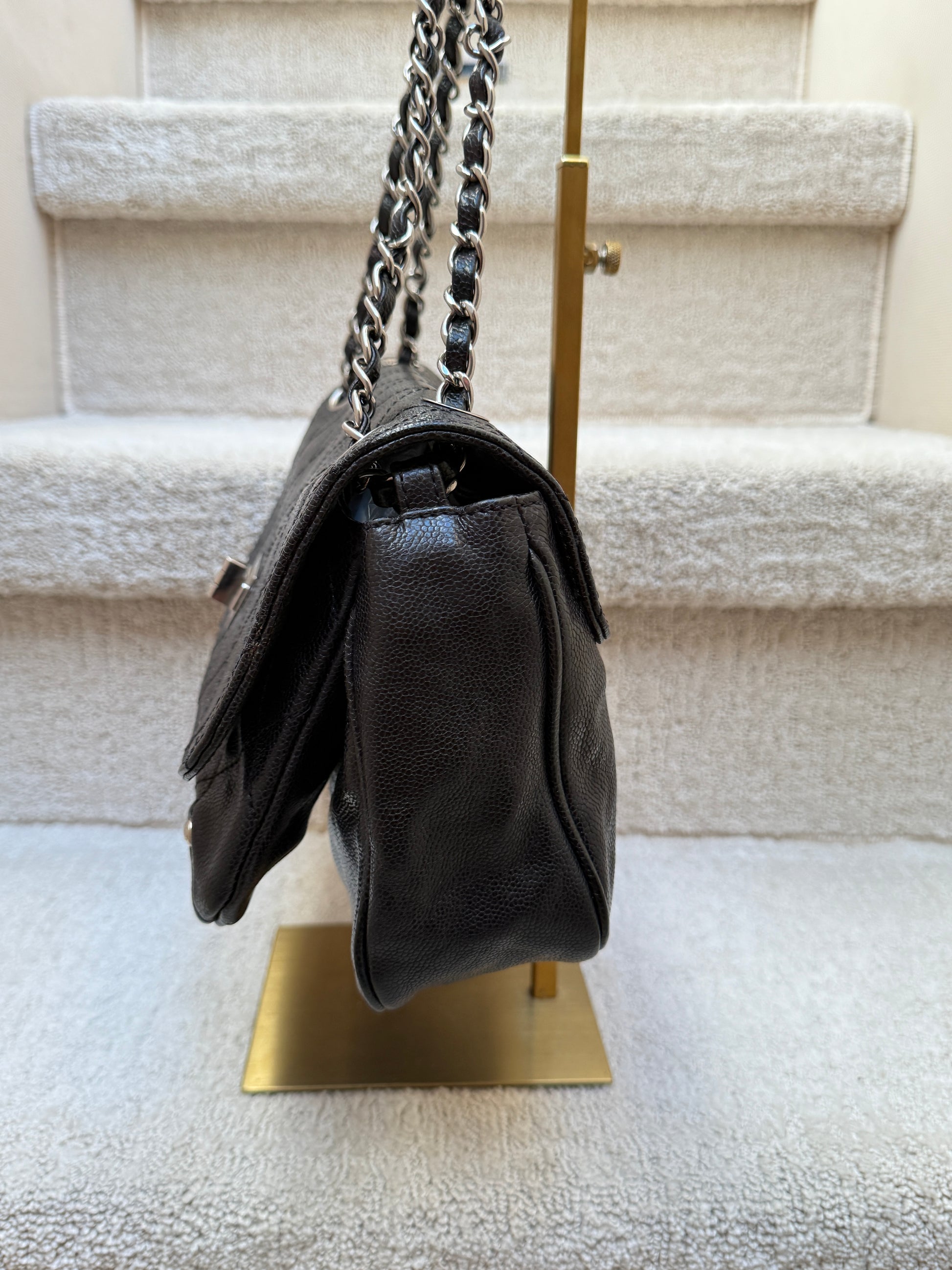 Chanel 2.55 re-issue side view of bag while stuffed