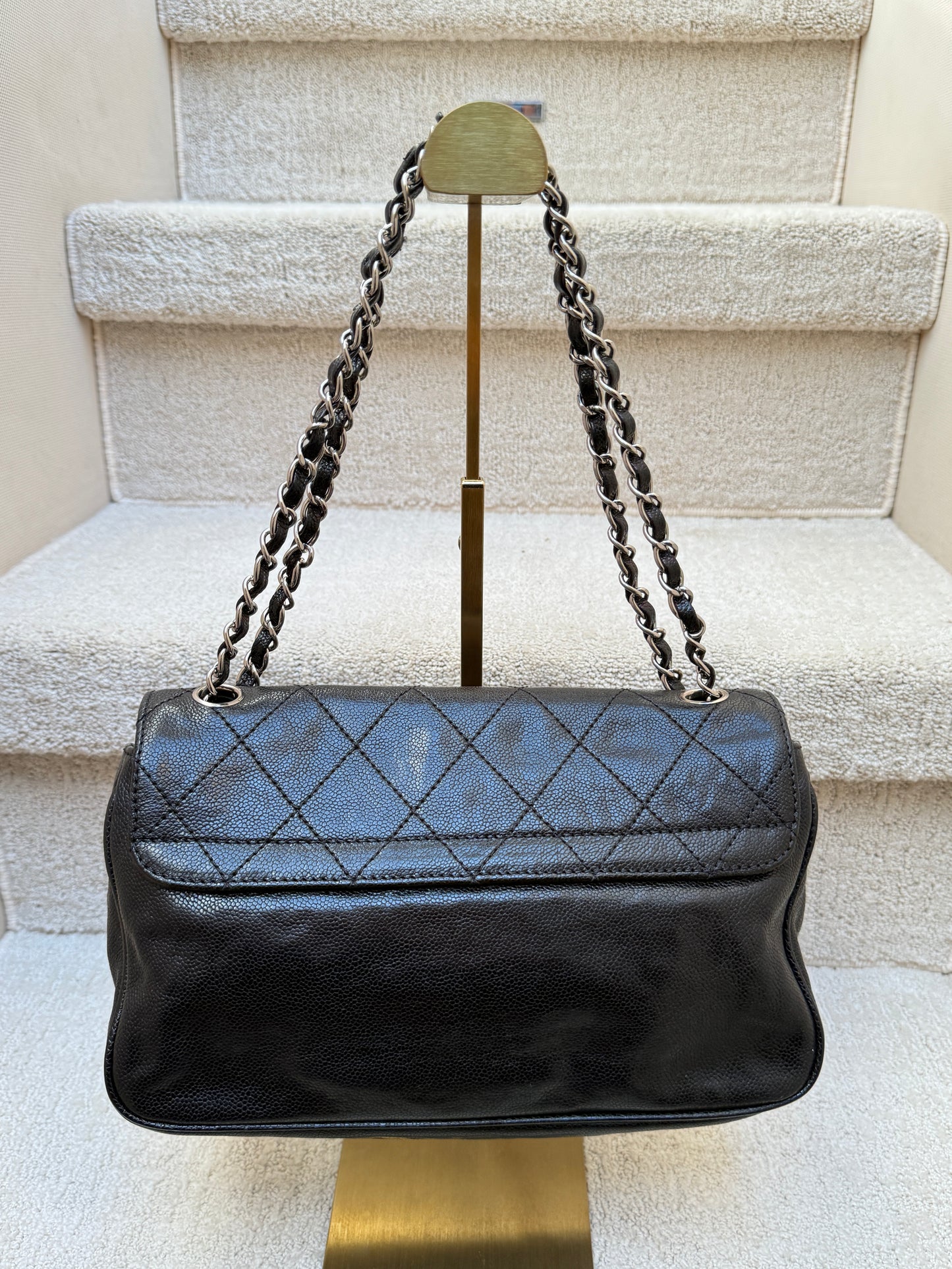 Chanel 2.55 reissue in black view of back of bag for sale