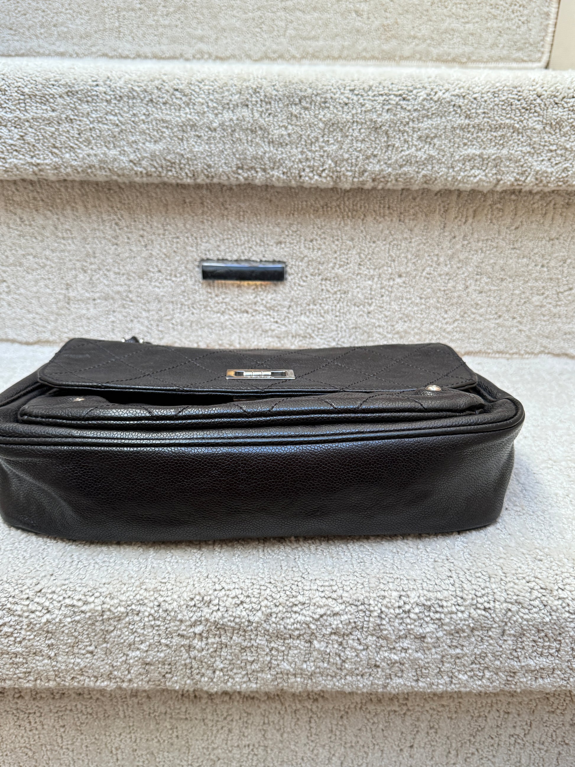 Chanel 2.55 reissue caviar flap back view of bottom of handbag preloved