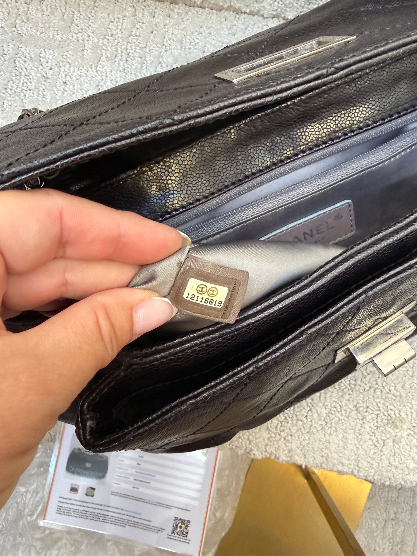 Close up of serial number on chanel 2.55 reissue flap in black